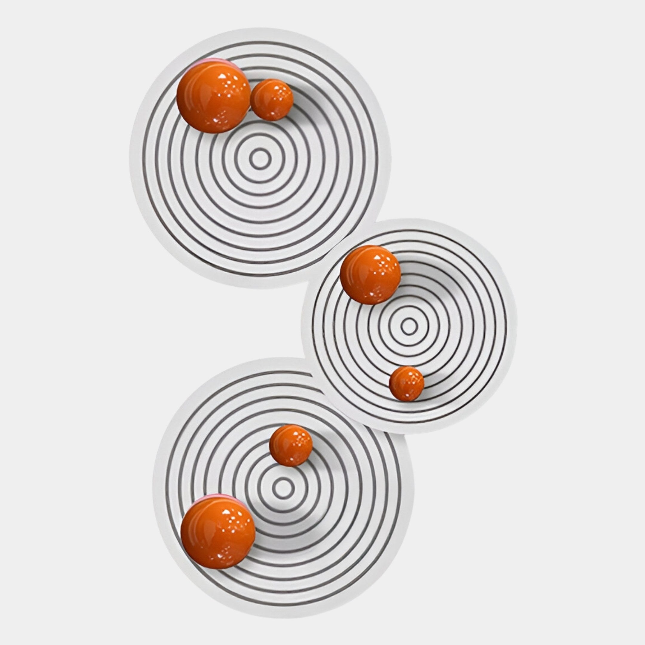 The Orbiora Orange Orb 3-Panel Concentric Sphere 3D Wall Art by Giant Sculptures features glossy orange spheres on white targets with black rings, creating bold, modern geometric wall decor against a plain background.
