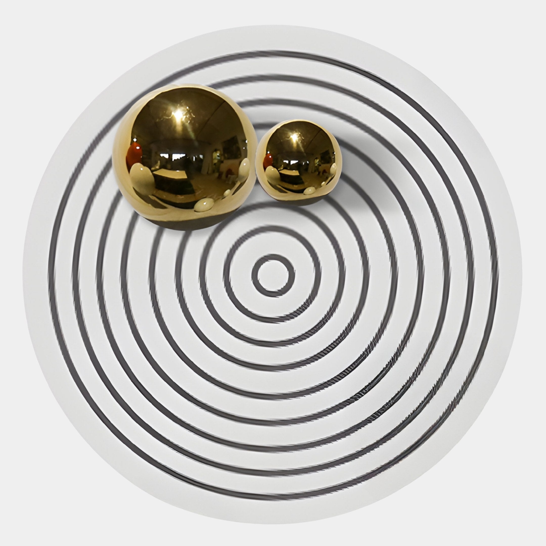 The Orbiora II Gold Duo Concentric Sphere 3D Wall Art by Giant Sculptures features two reflective gold spheres on a white surface with black concentric circles, creating a striking, geometric effect for any luxury space.