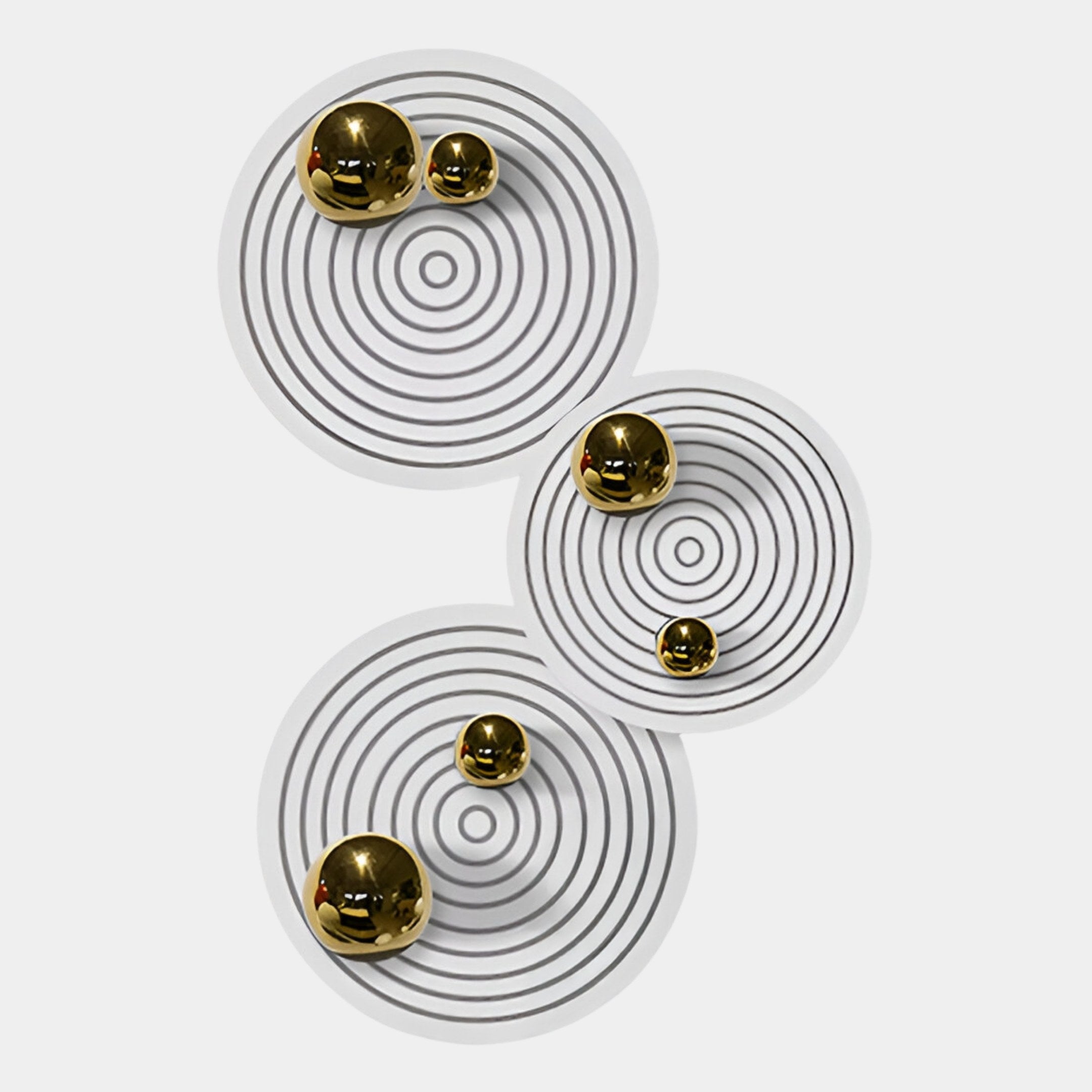 The Orbiora Gold Orb 3-Panel Concentric Sphere 3D Wall Art by Giant Sculptures features three white panels with black rings and gold spheres, creating striking modern decor ideal for luxury interiors.