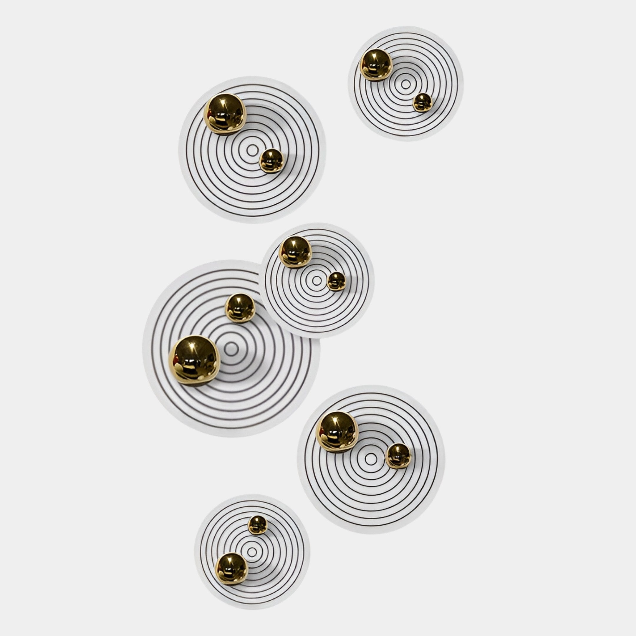 The Orbiora Gold Orb 6-Panel I Concentric Sphere 3D Wall Art by Giant Sculptures features seven white circles with black rings and gold spheres, creating a striking modern wall sculpture for sophisticated decor on a plain white background.