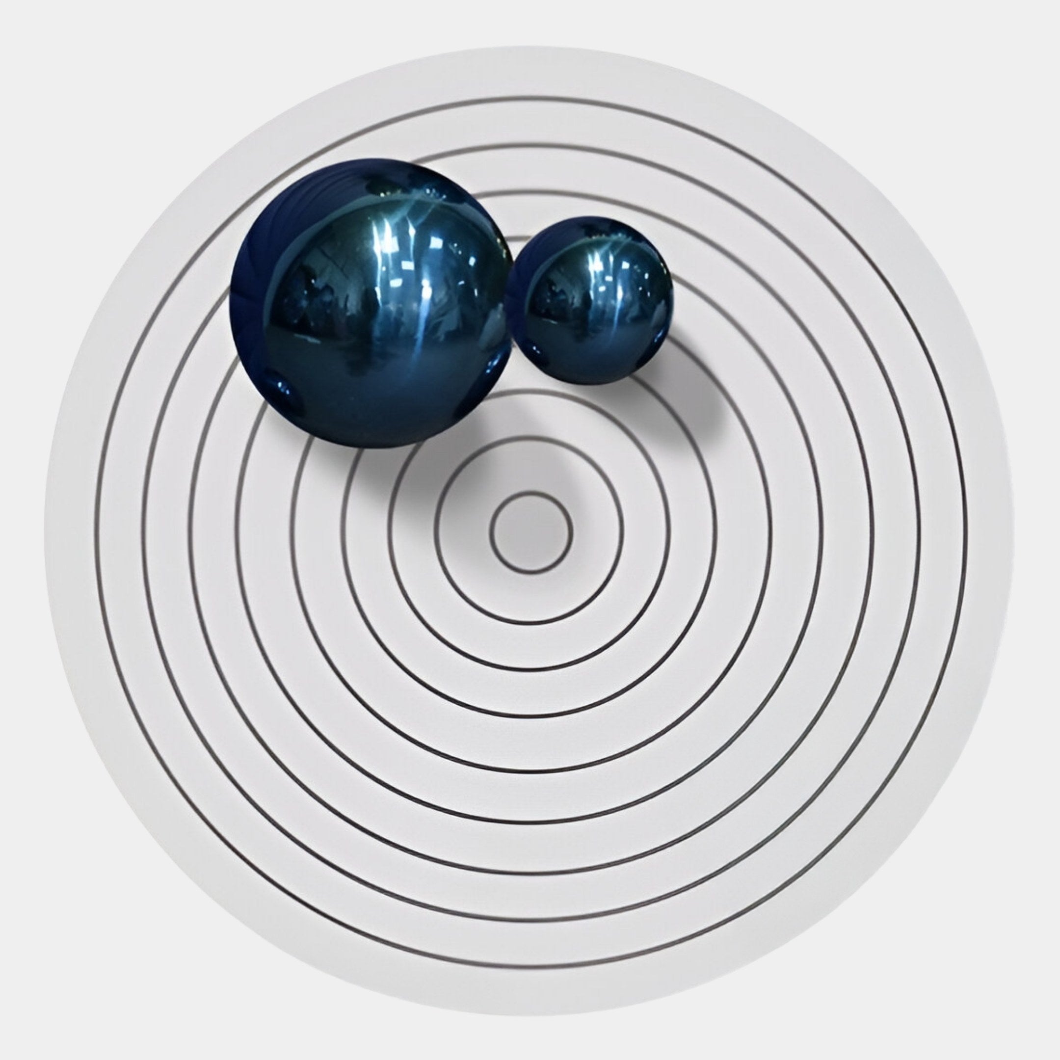 The Orbiora II Blue Duo Concentric Sphere 3D Wall Art by Giant Sculptures features two shiny blue spheres on a white surface with black concentric circles, making it ideal modern wall decor with a minimalistic geometric style.