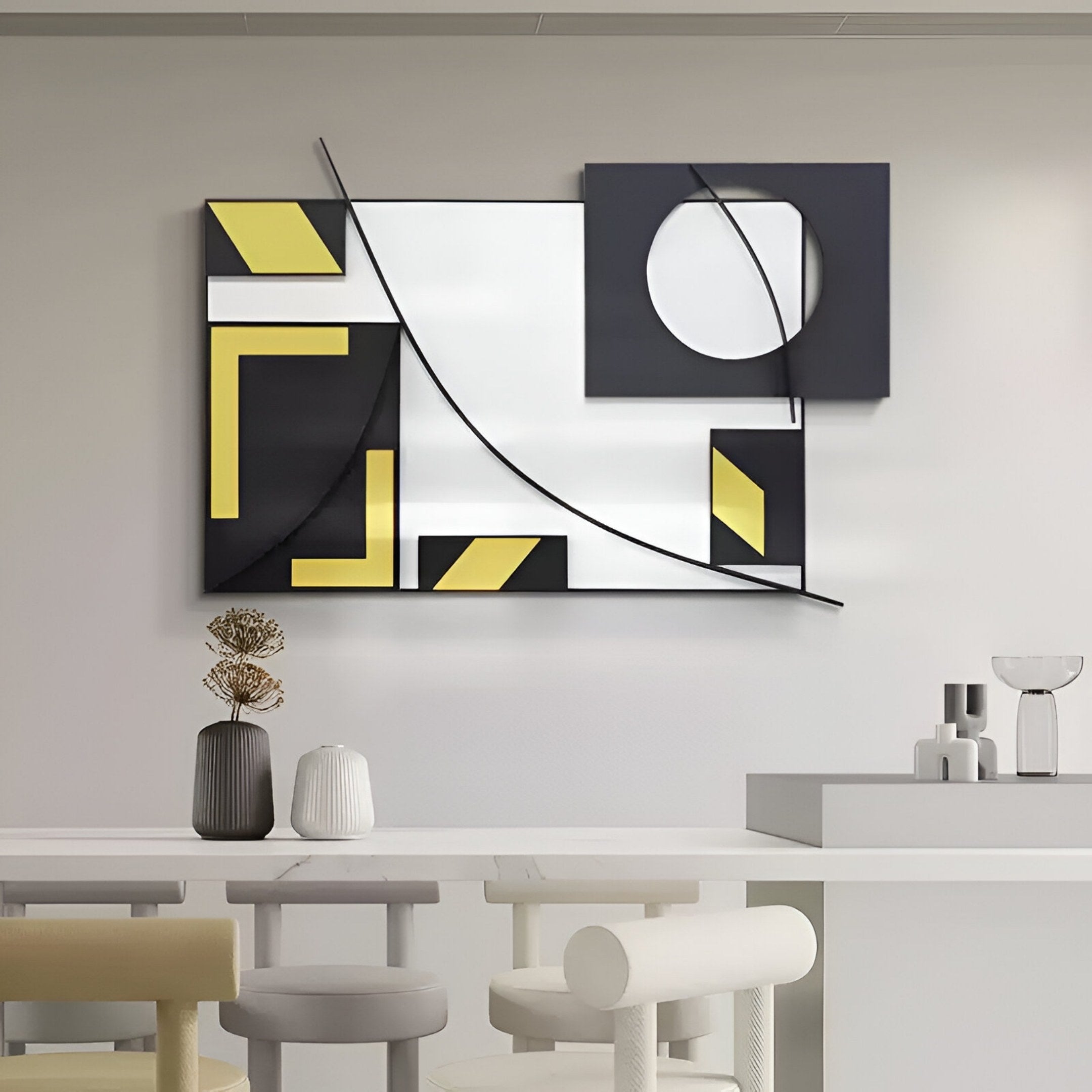 The Struktura Yellow & Black Geometric Curve 3D Wall Art by Giant Sculptures hangs above minimalist white furniture and decor, including vases and a glass, adding bold modern style to the bright contemporary room.