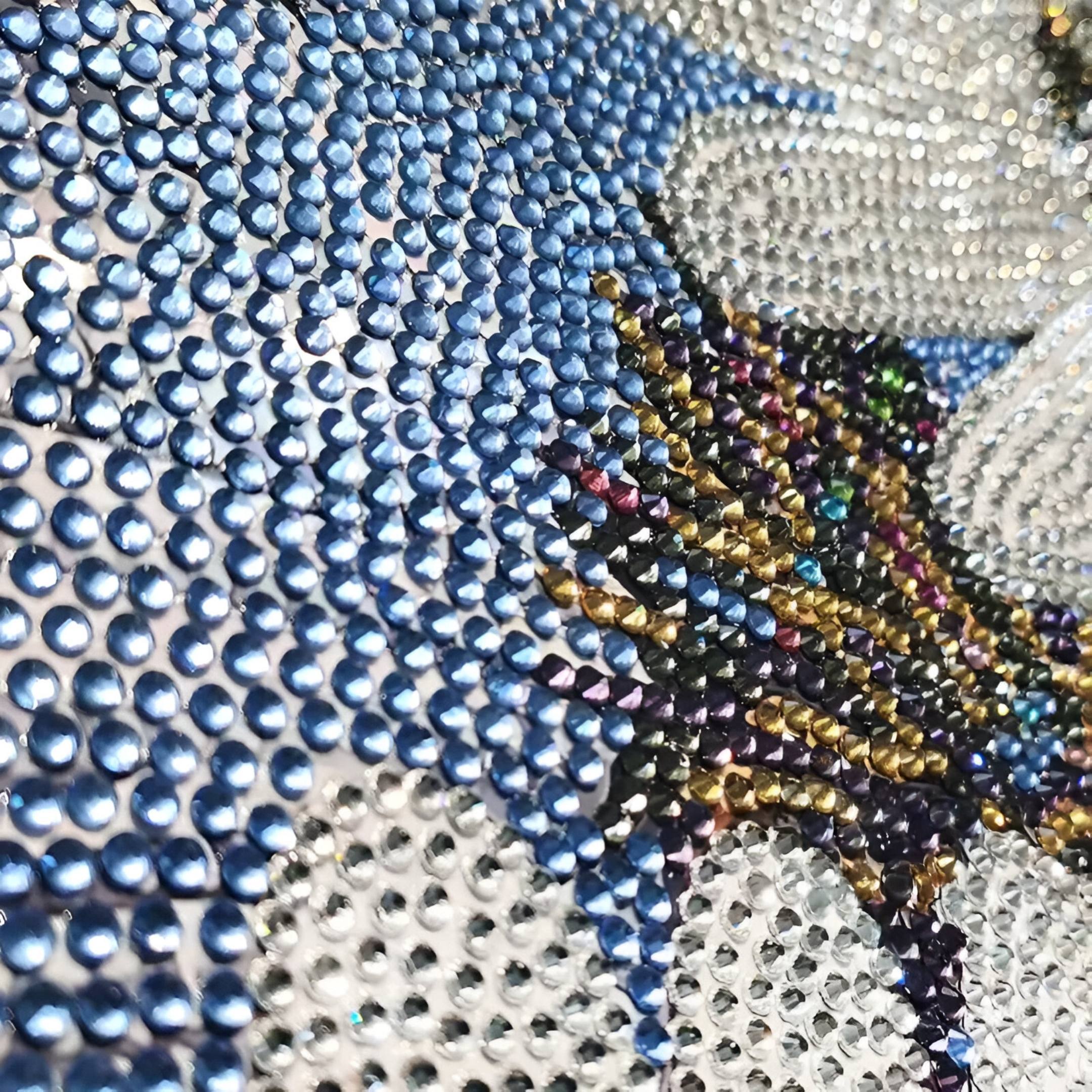 Close-up of Floravida White & Blue Crystal Daisy Floral 3D Wall Art by Giant Sculptures, featuring a sparkling mosaic of faceted rhinestones in blue, gold, black, and white for striking contemporary wall decor.