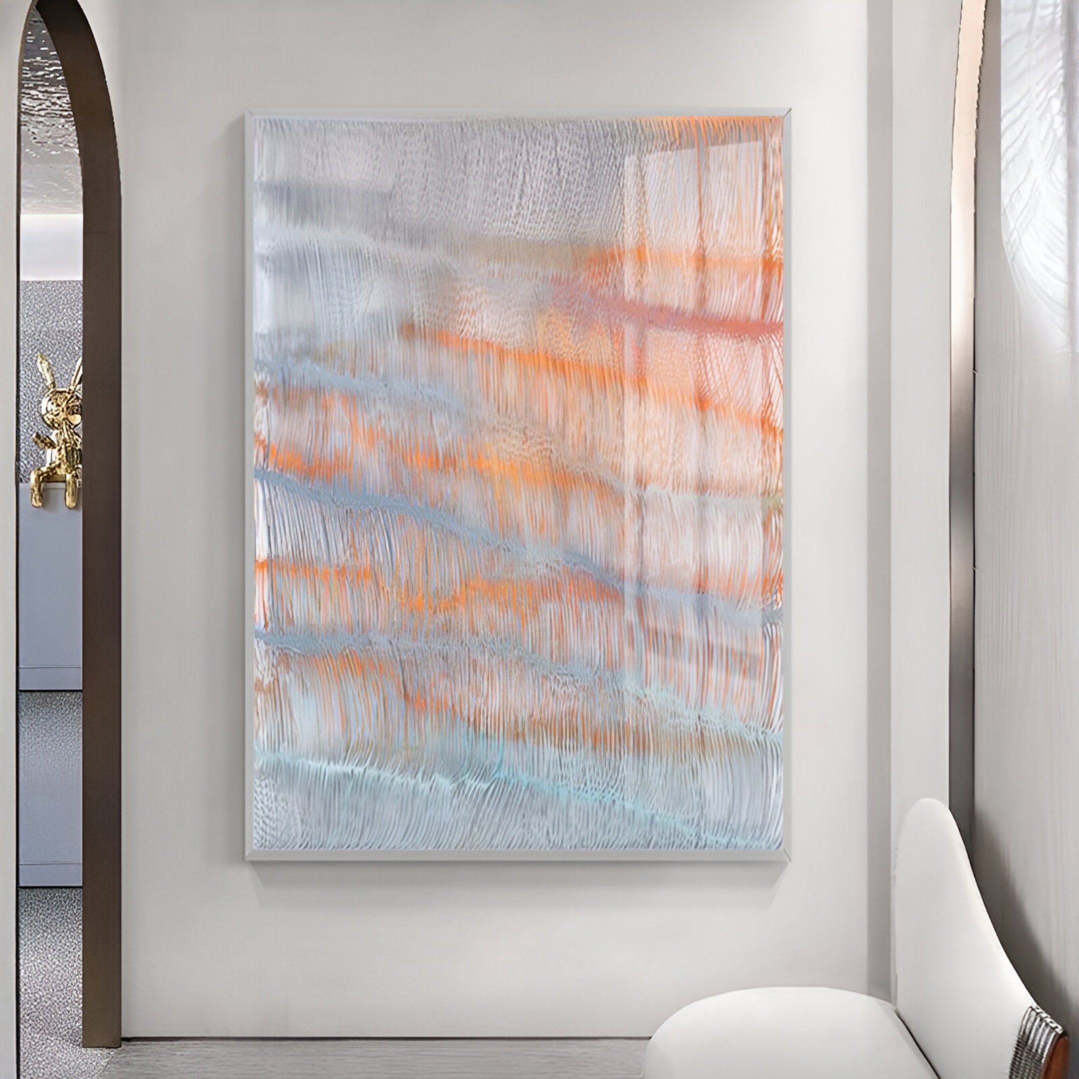 The Aqualis Sunset Orange & Blue Textured Acrylic 3D Wall Art by Giant Sculptures hangs on a white wall in a minimalist room with curved furniture and neutral tones, showcasing abstract wavy lines in light blue, orange, and white.