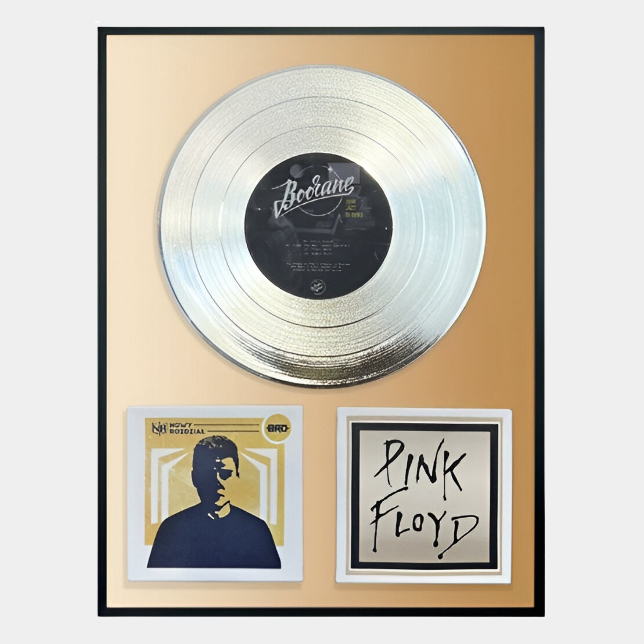 The Sonarta Gold Pink Floyd & Bocane Record Tribute Wall Art by Giant Sculptures features a silver record, a photo, and the Pink Floyd logo on gold—making it standout music room decor for any fan.