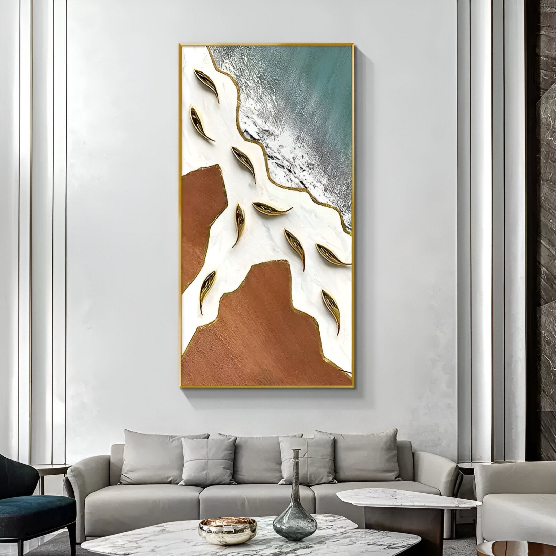 A modern living room with a beige sofa and round coffee table features Giant Sculptures’ Pisaro Gold Fish Ocean Edge & White Oil Canvas 3D Wall Art above the sofa, adding stylish, minimalist modern coastal decor.