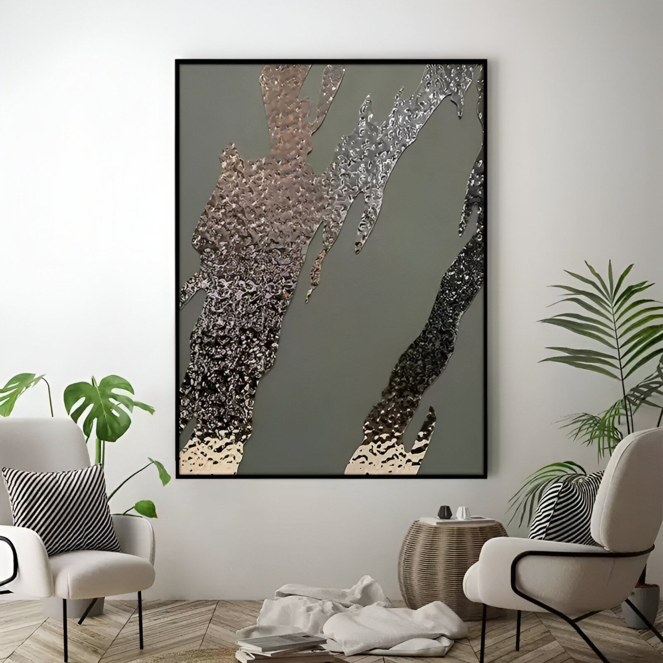 A modern living room with two armchairs, a round wicker table, green plants, and the Metallura Olive Green Metallic Flow Abstract 3D Wall Art by Giant Sculptures displayed on the wall.