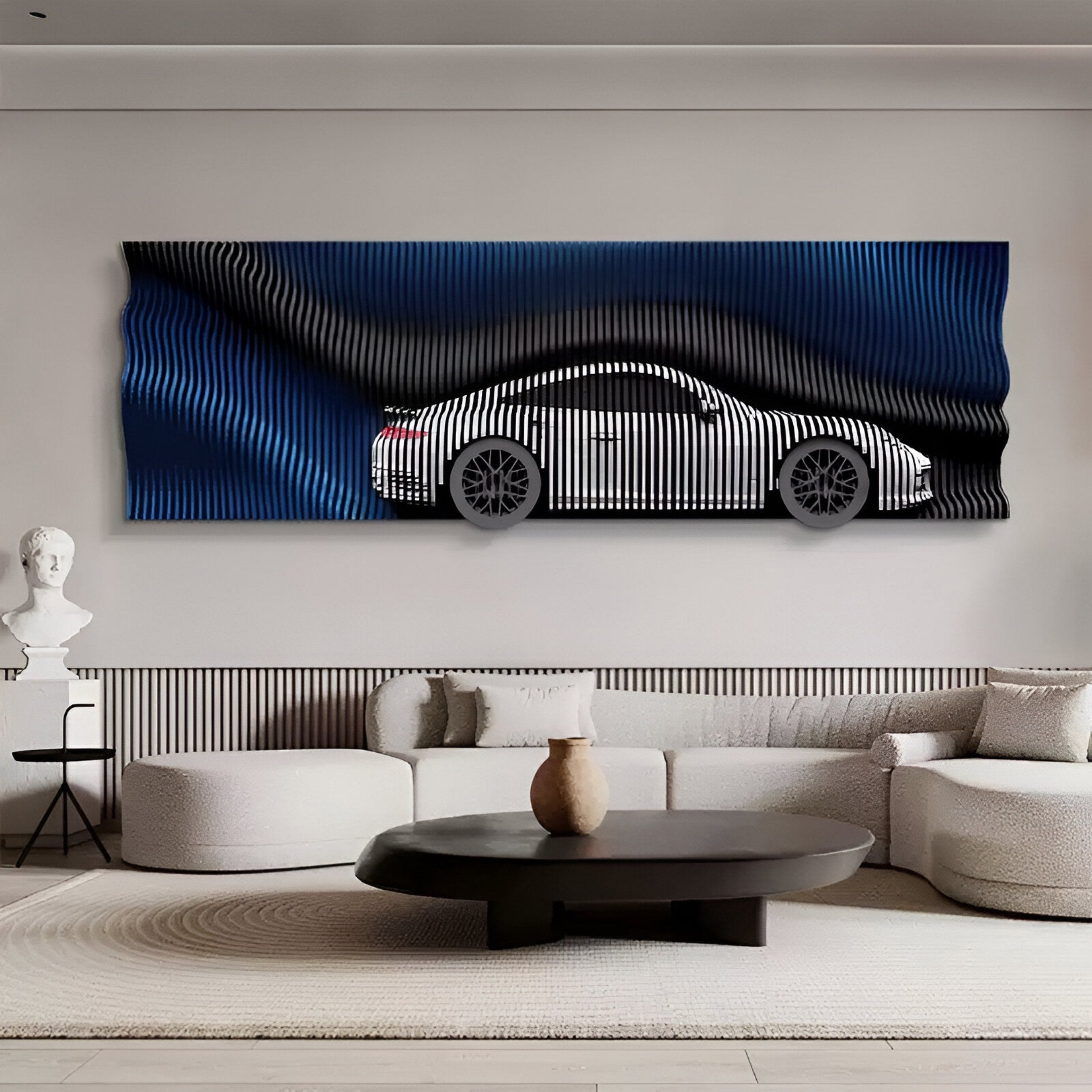 A modern living room with a white sofa, round black coffee table, and Giant Sculptures' Velocedra Blue Gradient Silver Sportscar 3D Relief Wall Art with a wavy blue-black backdrop. A white bust on the side table completes the bold décor.