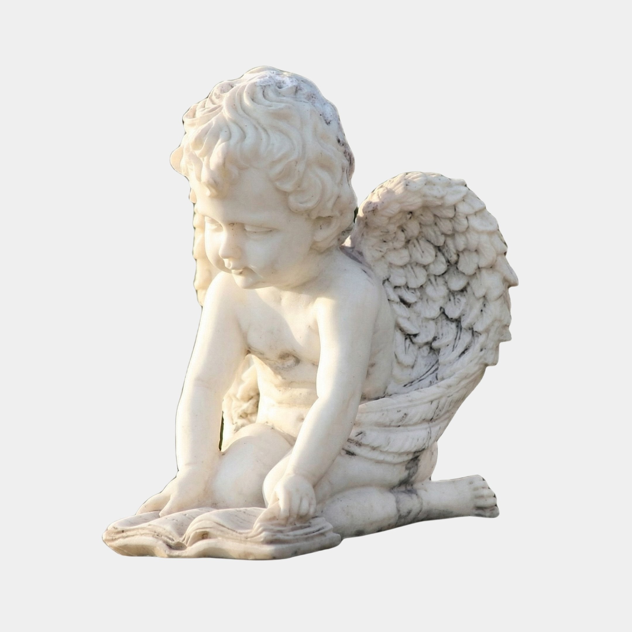 Small Angel Reading Angel Marble Outdoor Sculpture – 50cm by Giant Sculptures, a white marble cherub with curly hair and detailed wings seated reading an open book, on a light grey background.