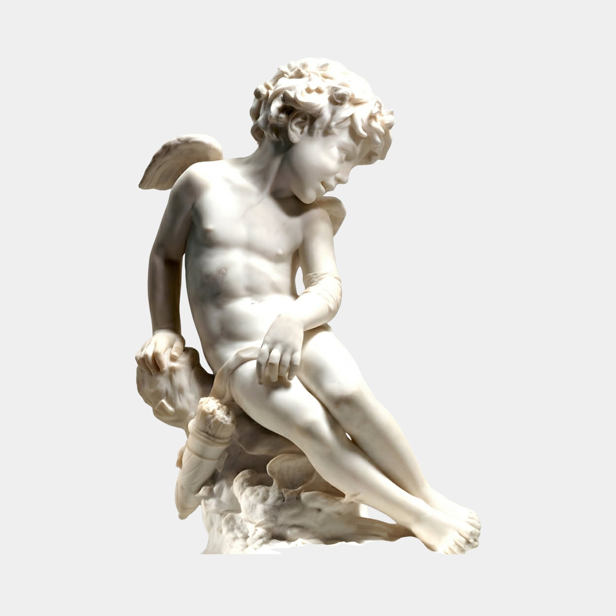 Eros Cupid Angel Marble Outdoor Sculpture in white natural marble depicting a seated winged youth with curly hair and a contemplative downward gaze, set against a plain light grey background.