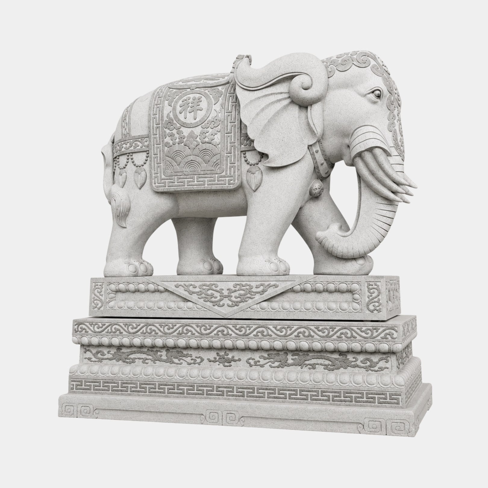Grey granite caparisoned elephant on a tall banded pedestal