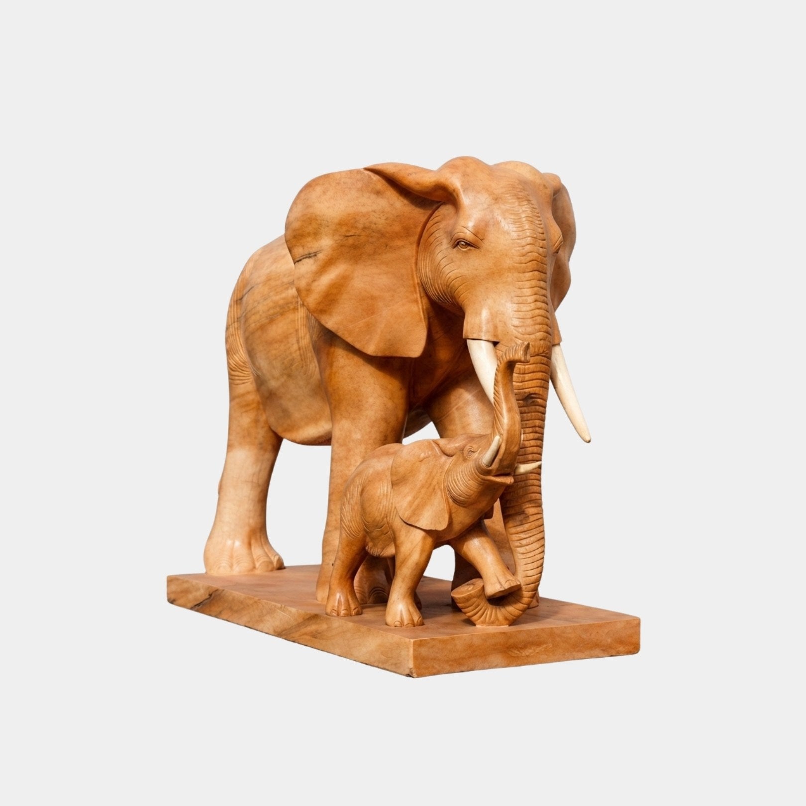 Caramel marble elephant with a calf beside her on one slab