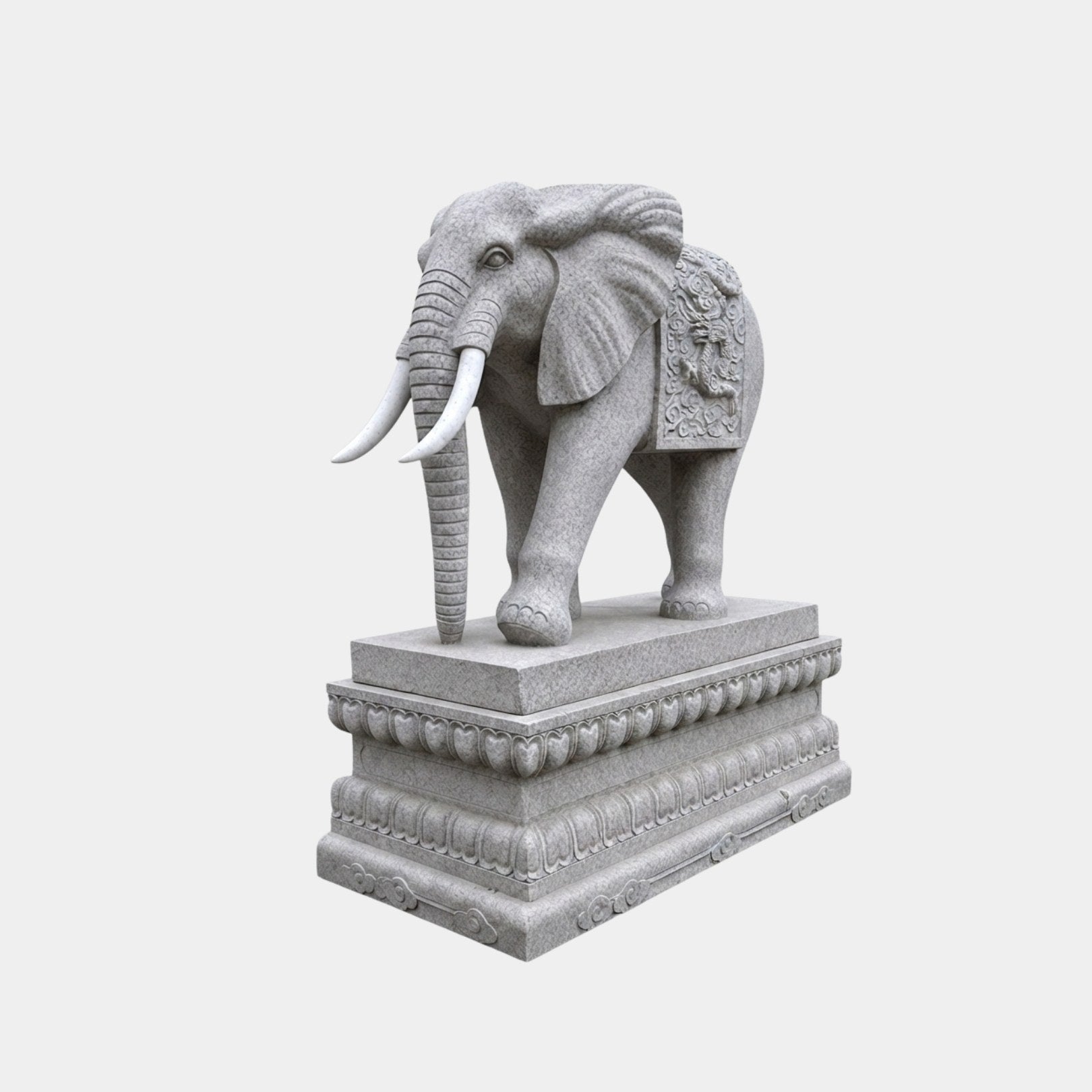 Grey granite elephant with pale tusks and a carved mask cloth