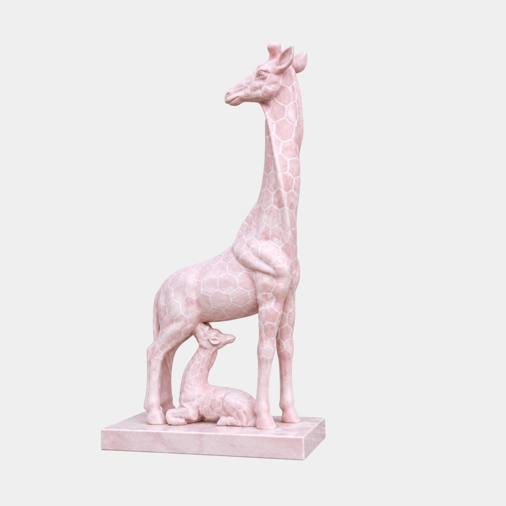 Pink marble giraffe standing with her calf lying between her legs