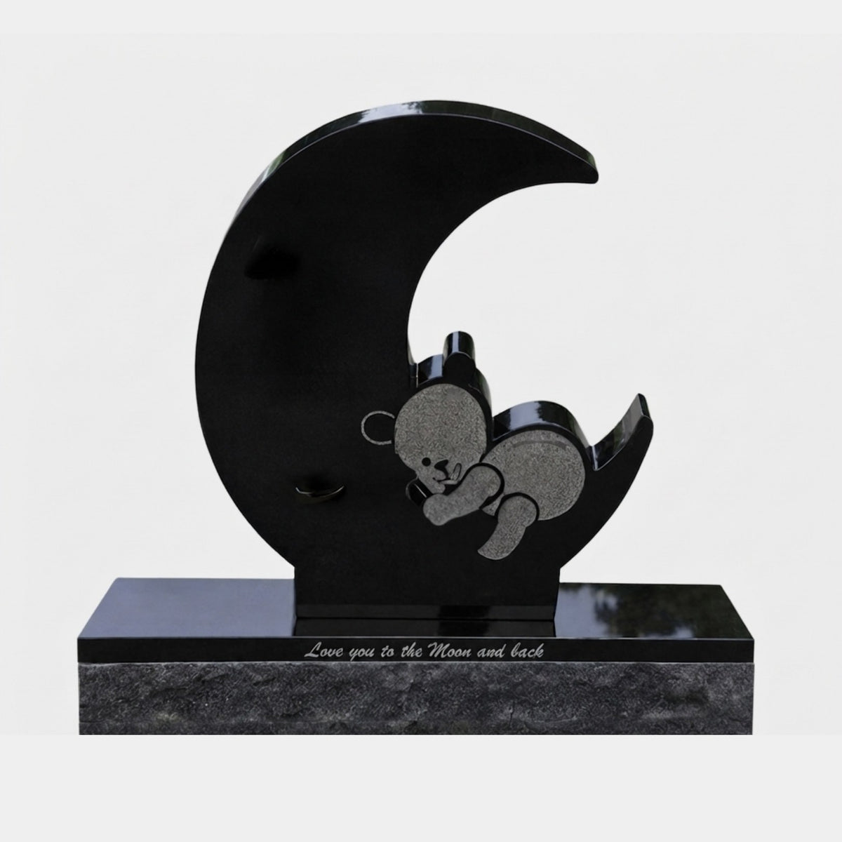 Polished black granite crescent moon with a matte sleeping bear on its horn, 110cm