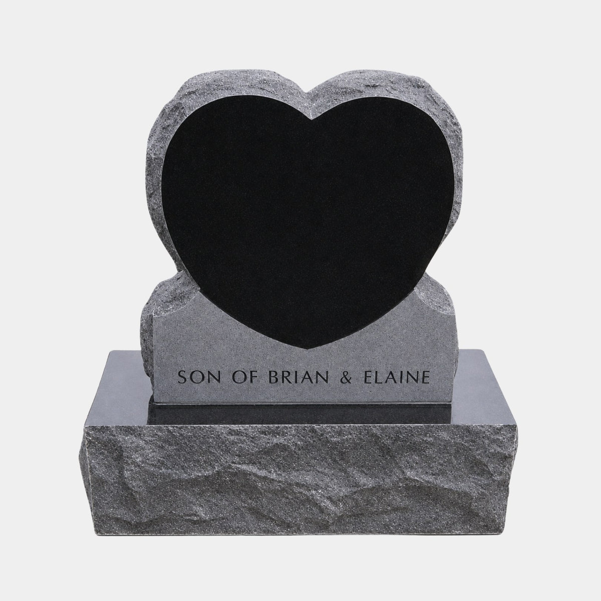 Mirror polished black heart set into a rock-pitched grey granite surround, 120cm