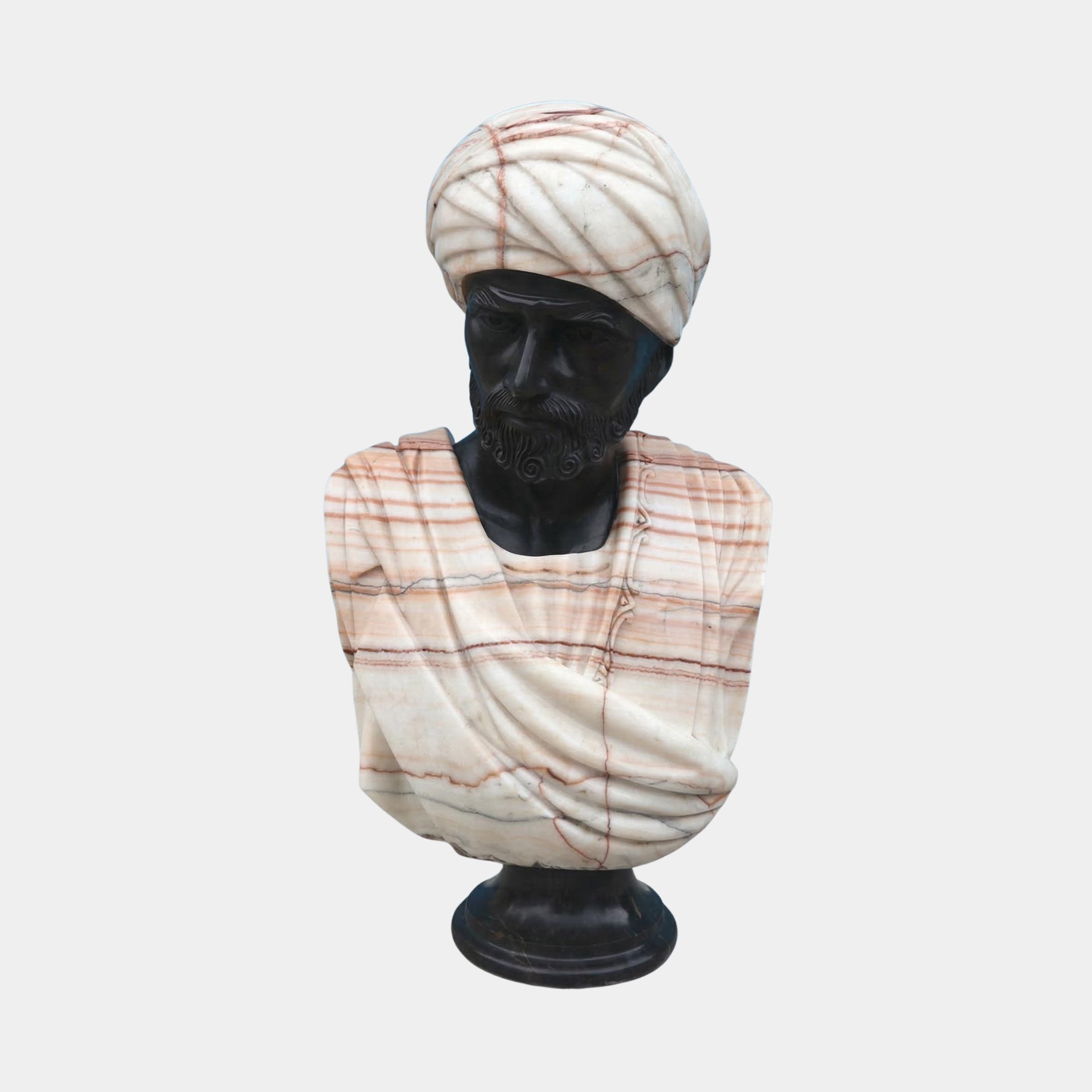 The Moorish Turban Marble Bust Sculpture - 65cm by Giant Sculptures features a bearded man in a turban and draped robe, crafted from dark and light marble with brown veining, displayed against a plain white background.