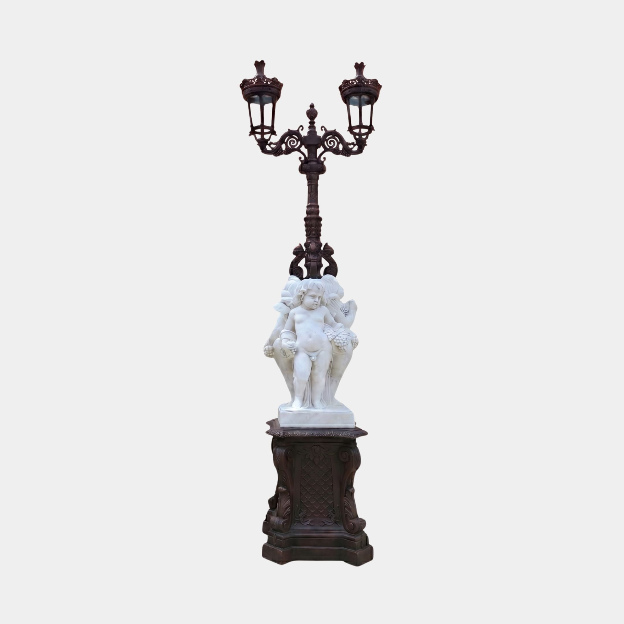 Giant Sculptures Cherub Group Two-Arm Lamp Marble Sculpture 250cm with white marble cherubs holding grapes on a bronze-finish pedestal and twin lanterns.