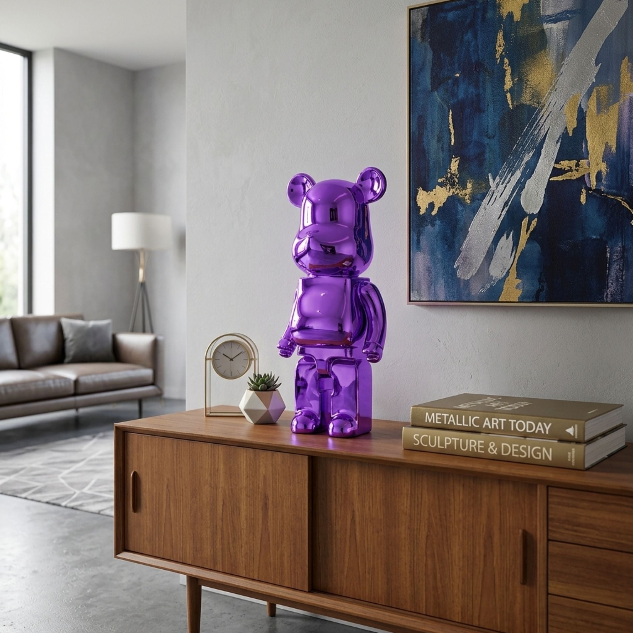 Phantom Purple Bear Sculpture - 50cm in glossy electroplated purple resin, displayed on a wooden sideboard in a living room near books and framed art.