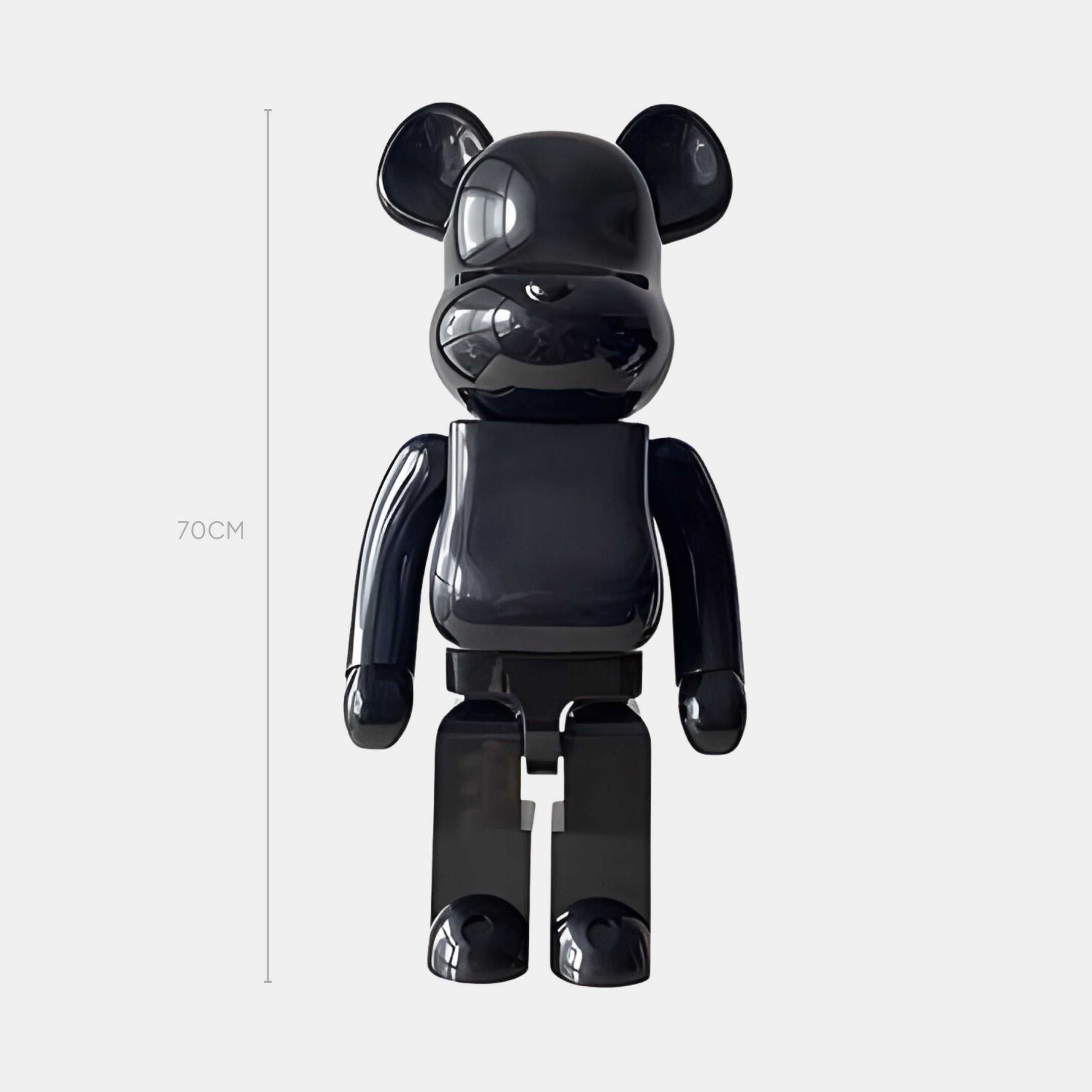 The Pure Black Bear Sculpture - 70cm by Giant Sculptures features a glossy black finish and rounded ears, arms, and legs. Standing upright, its perfect as minimalist décor or a standout collectible for any modern space.