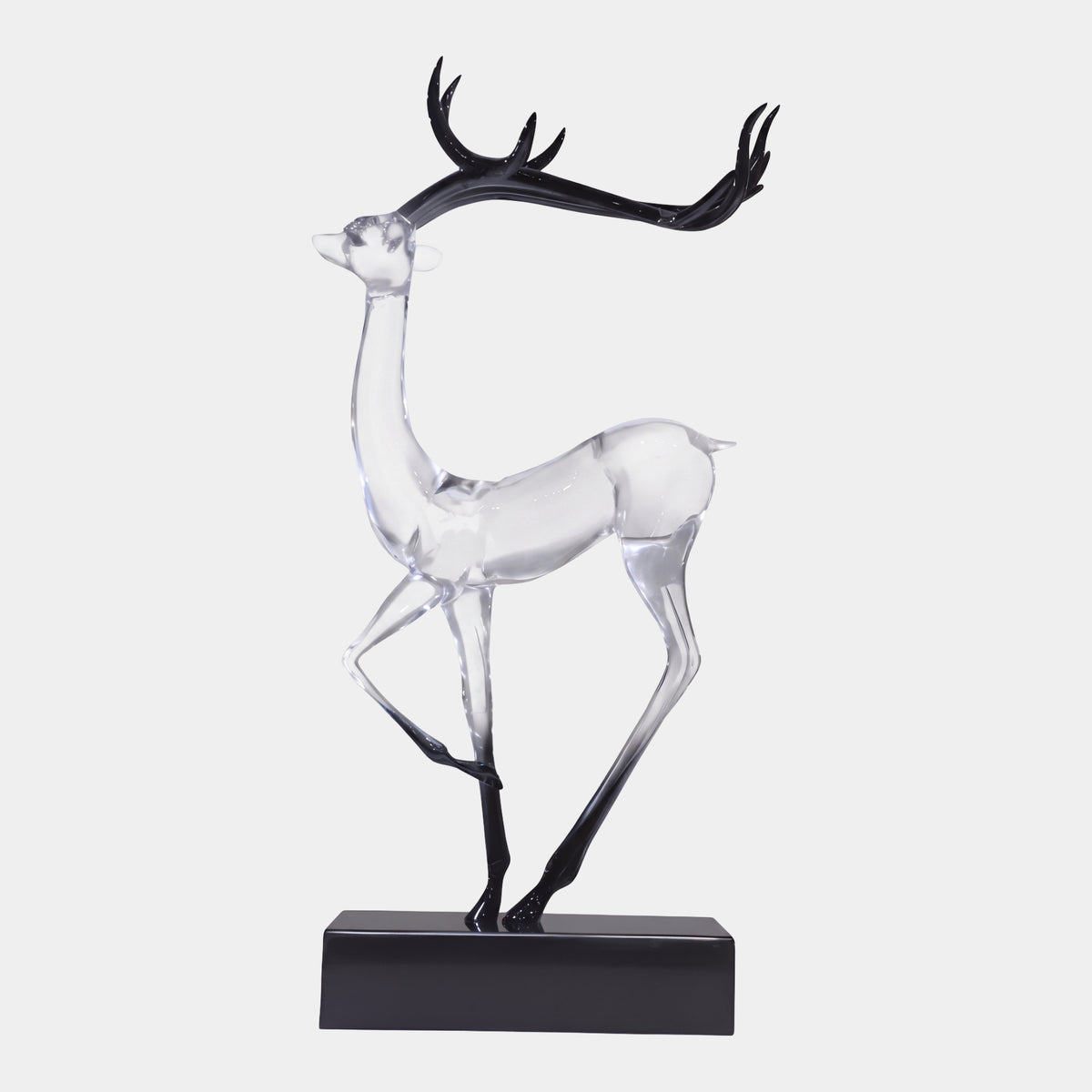 Clear Stag with Black Antlers Cast Resin Sculpture, 66cm, raised neck and head with black antlers, legs fading to black hooves, on a black marble base, plain white background.