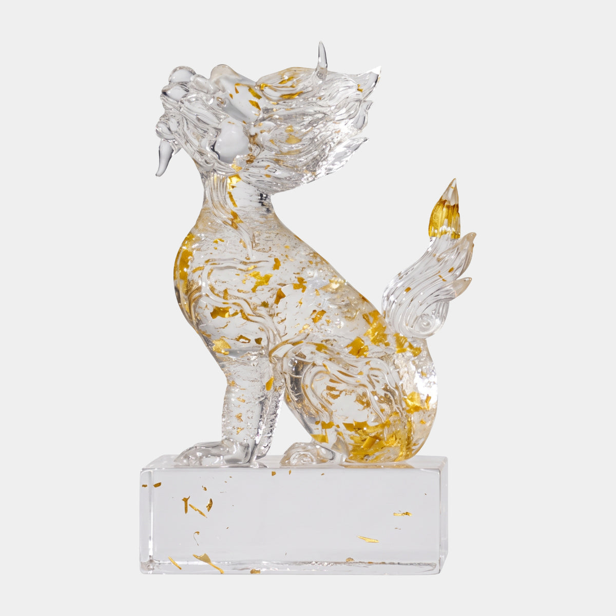 Clear Gold-Leaf Plumed Beast on a Base - 20cm, a resin dragon-like sculpture seated upright with curled tail plume, on a clear base against a plain light background.