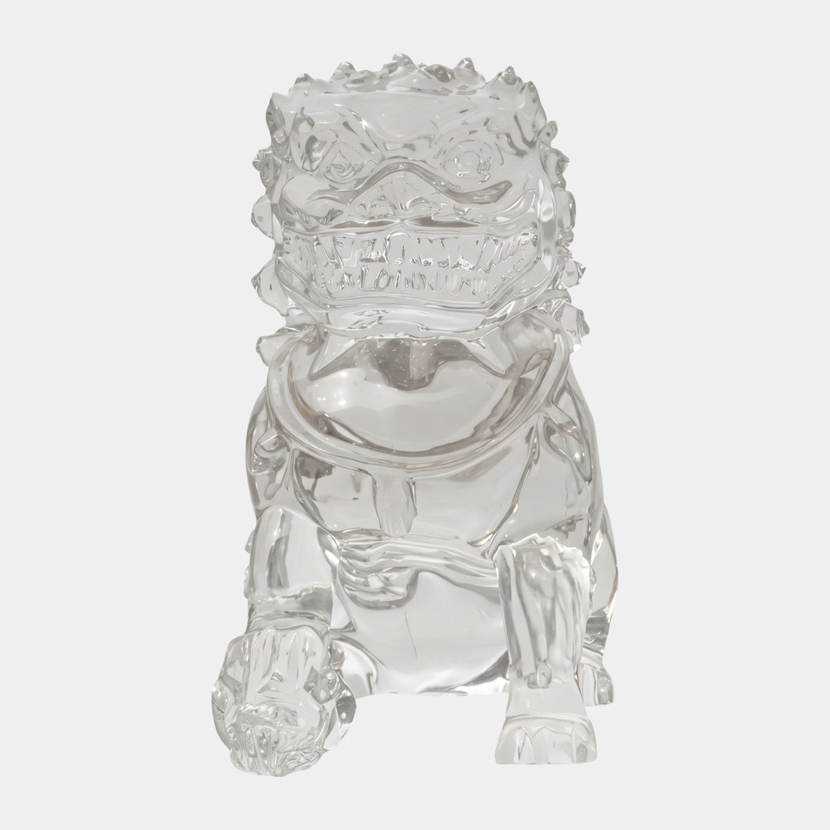 Clear Collared Guardian Lion Resin Sculpture, 83cm, seated with open mouth and one paw on a ball, polished clear resin, on a plain white background.