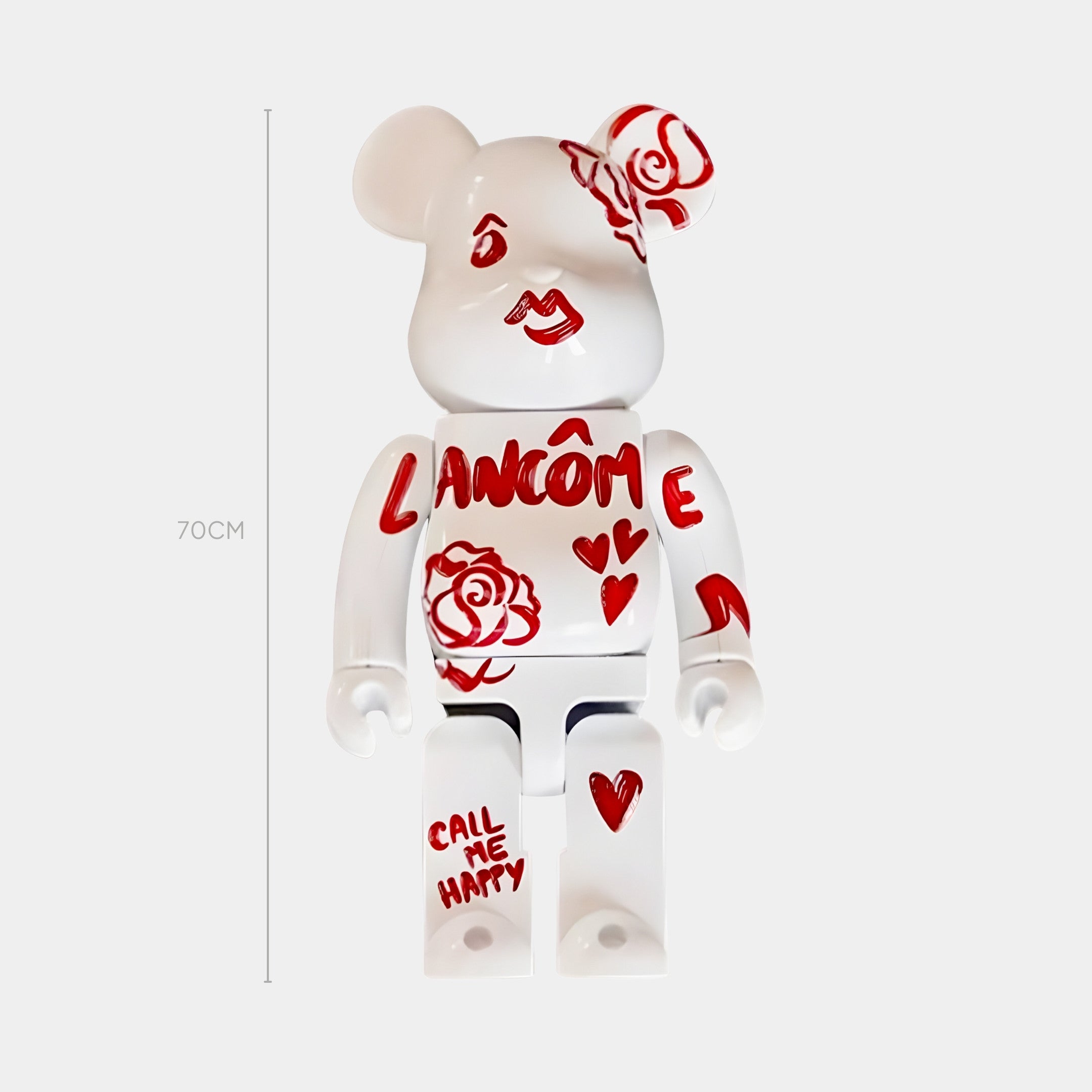 The Scarlet Sketch Bear Sculpture - 70cm by Giant Sculptures is a resin bear adorned with red roses, hearts, and the words LANCÔME and CALL ME HAPPY, shown here standing against a plain white background.