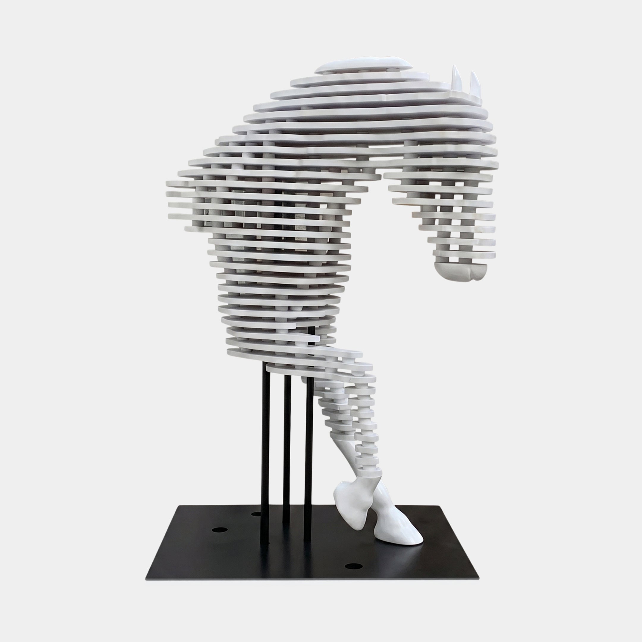 The 160cm Rising Stallion White Wood Horse Sculpture on its standard flat black base, showing the layered white wood slab construction and raised foreleg from the side.