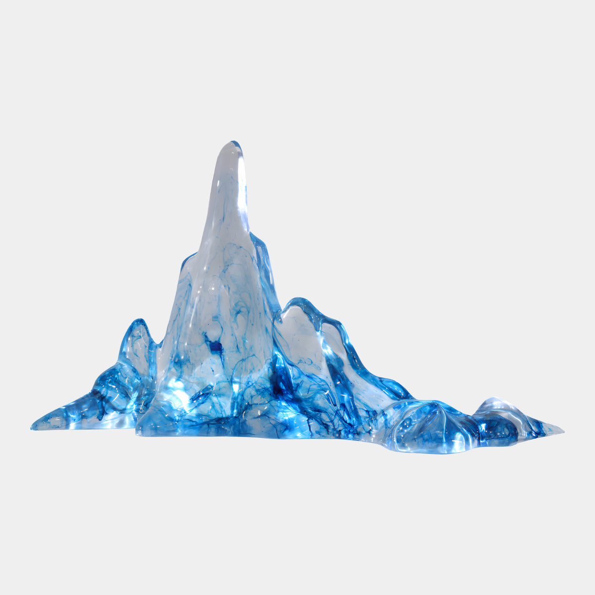 Blue Ink Veined Spire Mountain Resin Sculpture (105cm) by Giant Sculptures, a tall peaked spire with blue-veined ranges tapering outward, shown baseless on a plain white background.