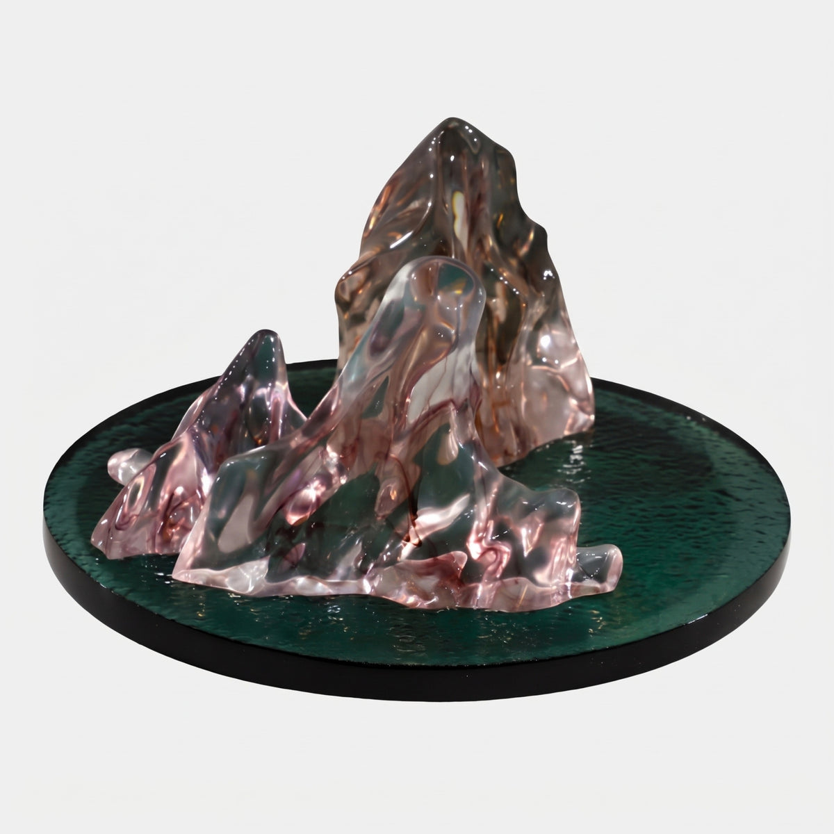 Pink Ink Three Peak Mountain Group Resin Sculpture (45cm) by Giant Sculptures, clear pink and dark green ink-washed peaks on a round dark green resin base, plain white background.