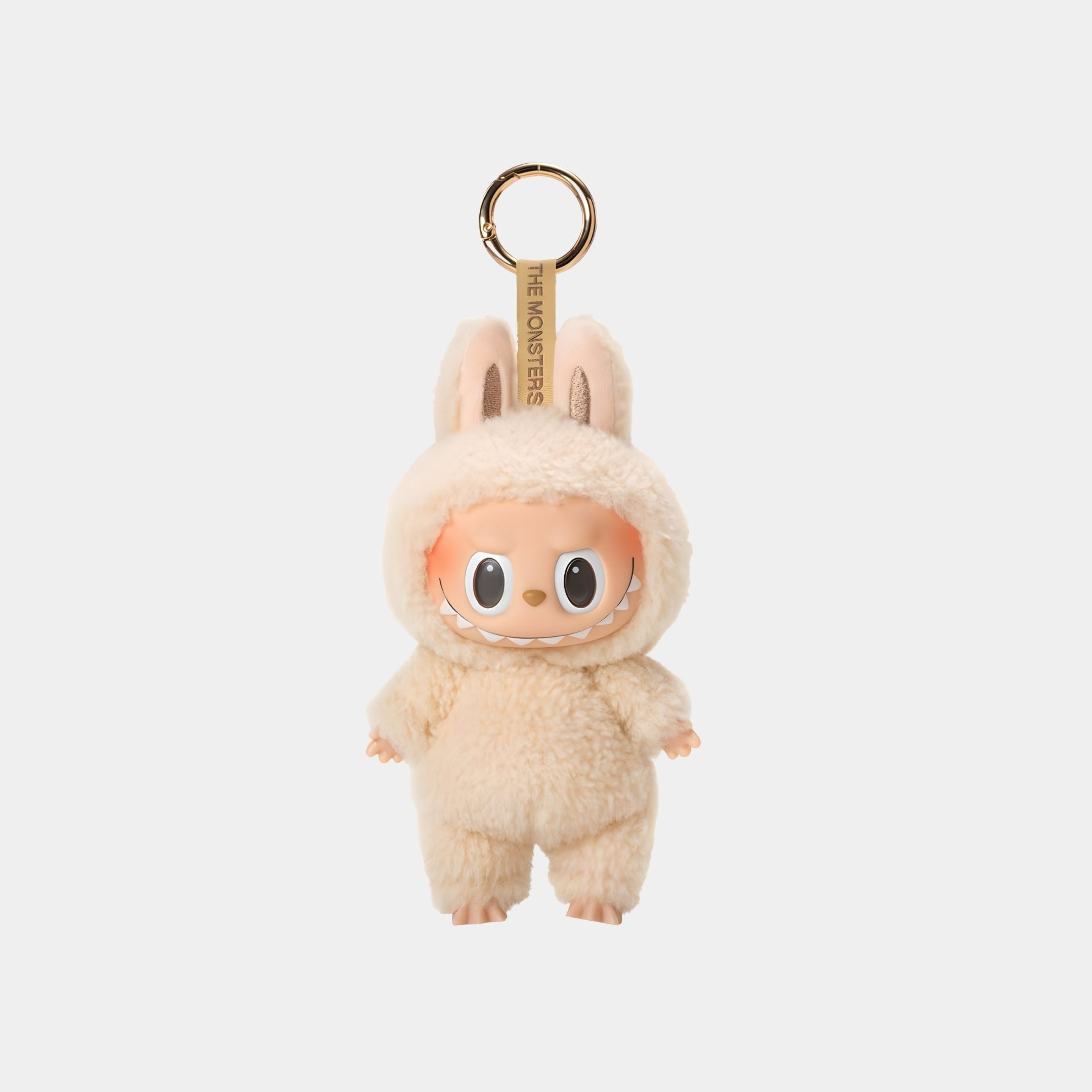 The Giant Sculptures Soymilk Macaron Labubu Keychain Figure (15cm) features a smiling doll in a fluffy cream bunny costume. Soft-textured, it's perfect as a collectible bag charm or adorable accessory.