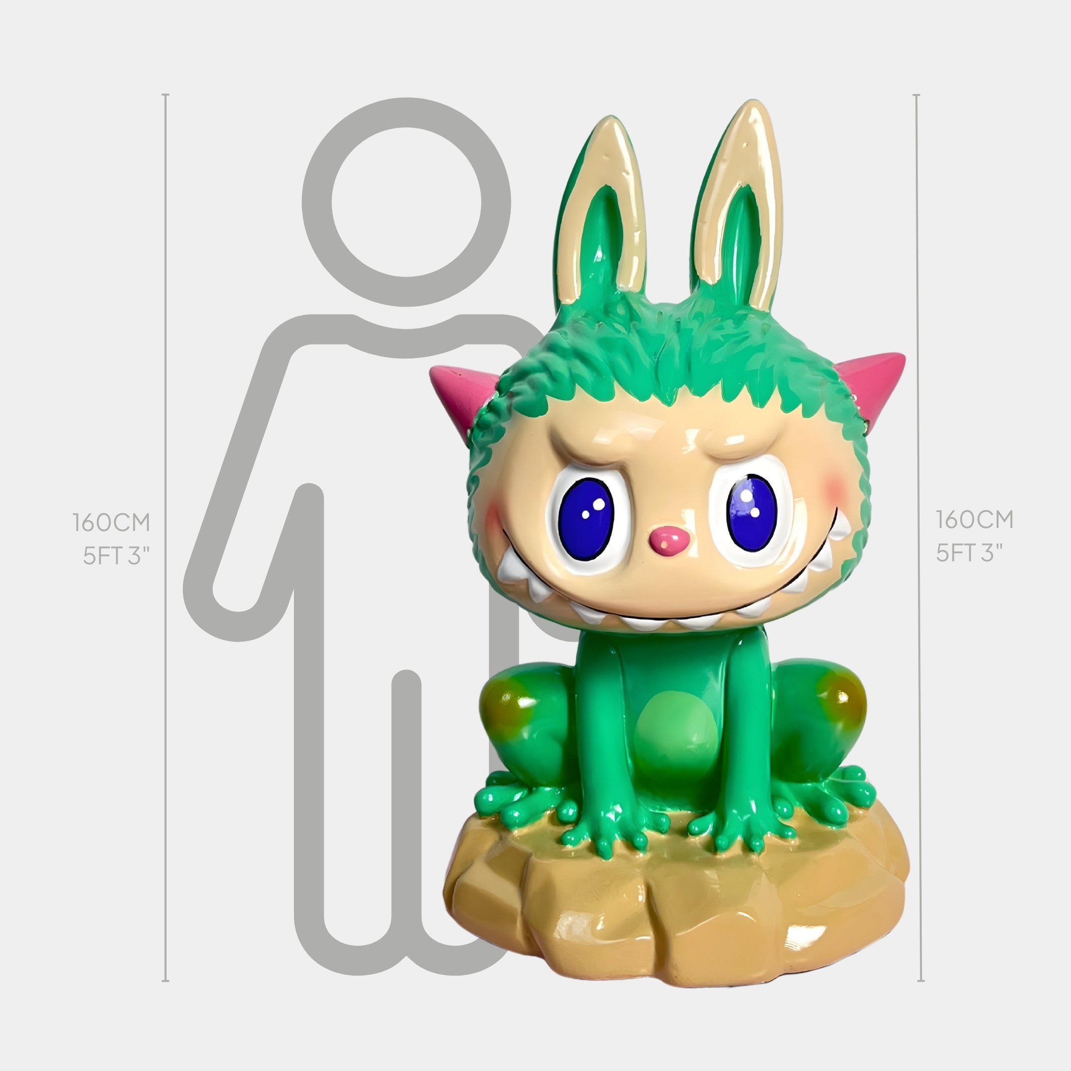 The Monster Frog Labubu Sculpture - 160cm by Giant Sculptures features a green, cat-like figure with big blue eyes, bunny ears, and pink cheeks on a brown base, inspired by alien bioluminescence. Shown next to a 160 cm human silhouette for scale.