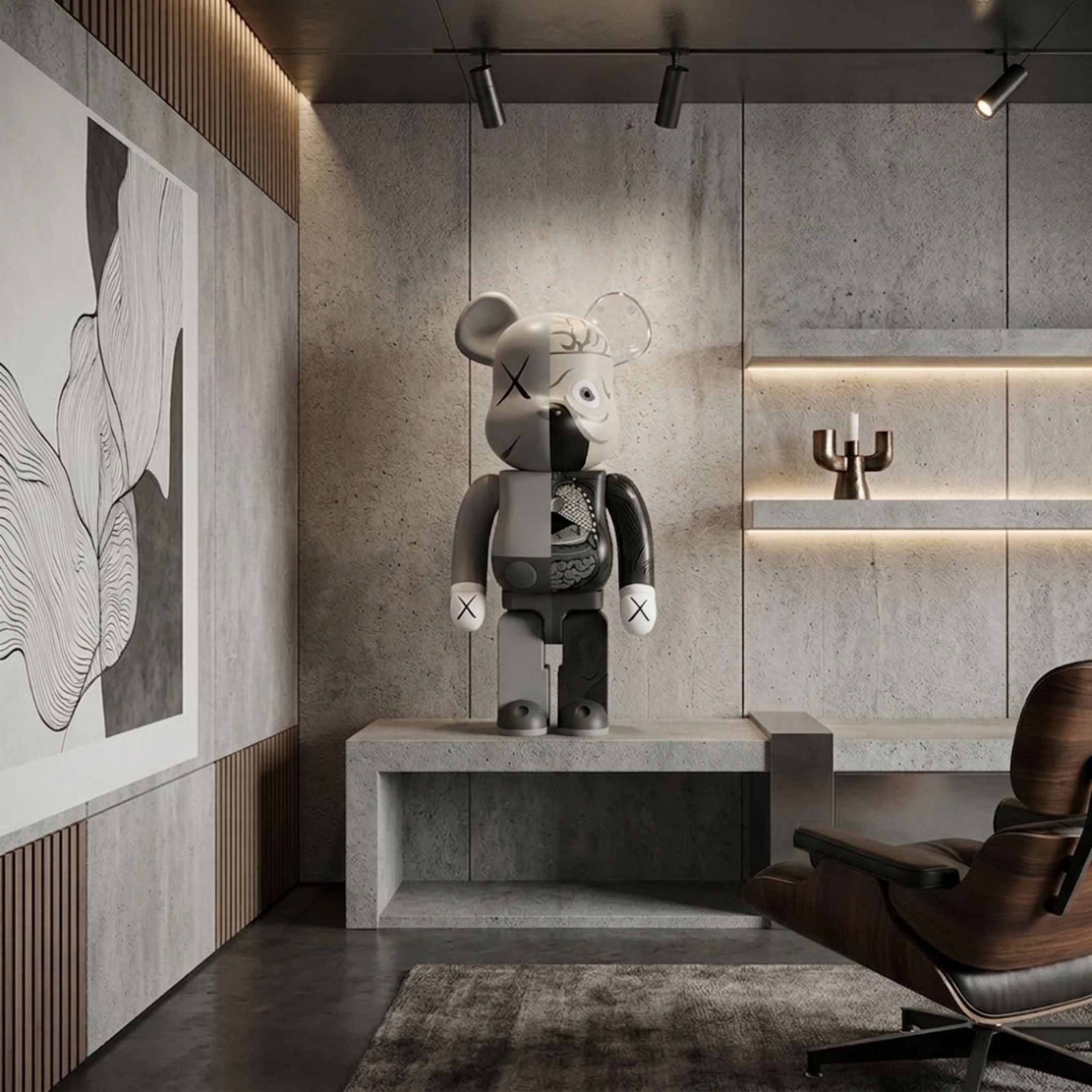 Split Anatomy Grey Bear Sculpture, 70cm, displayed on a concrete bench, showing matte grey X-eyes on one side and an anatomical black-grey study on the other, in a modern room with wall art and a wooden lounge chair.