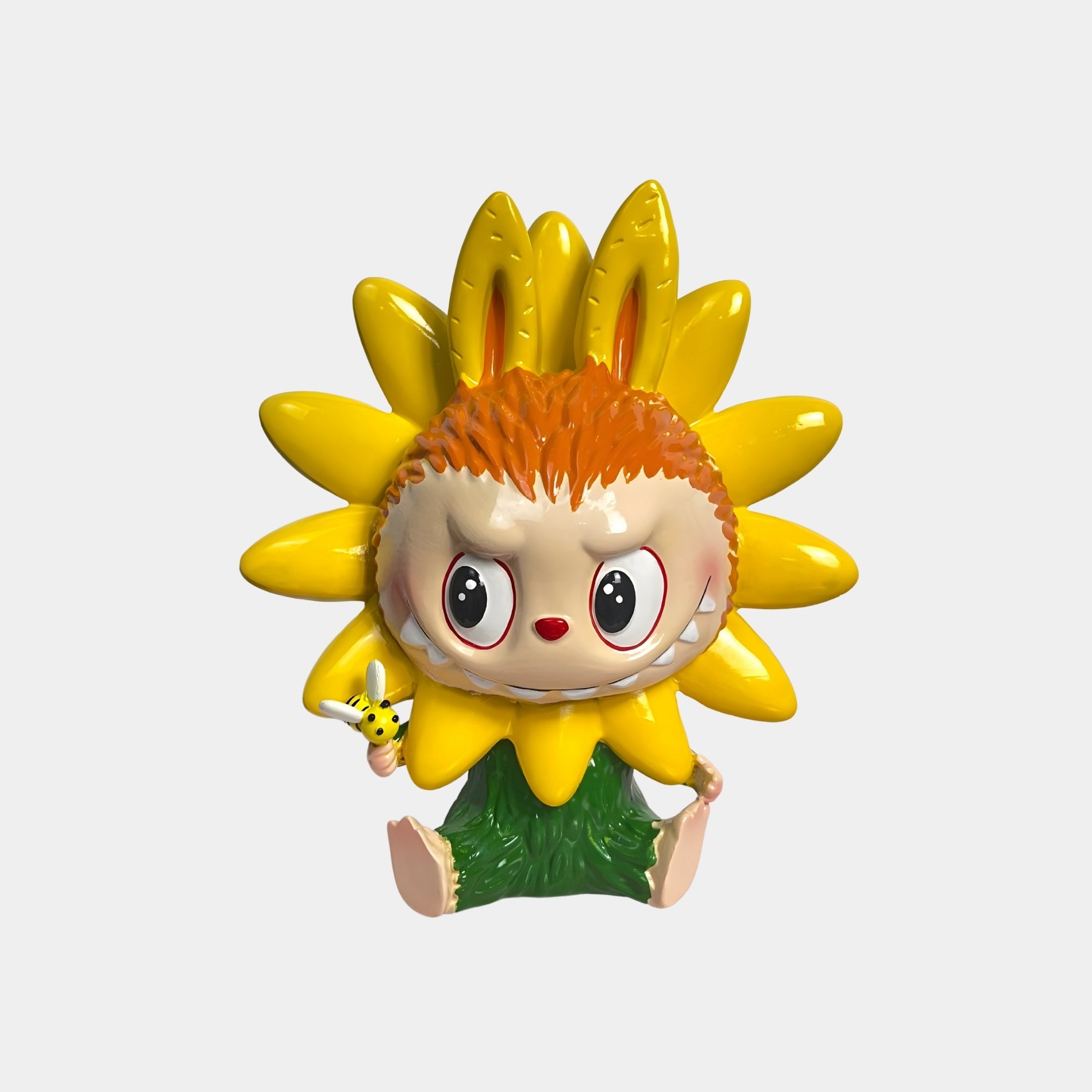 The Flower Elves Sunflower Labubu Figure by Giant Sculptures is a 30cm decorative piece featuring a sunflower-shaped face, orange hair, bunny-like ears, big round eyes, green leafy legs, and a tiny yellow bee.
