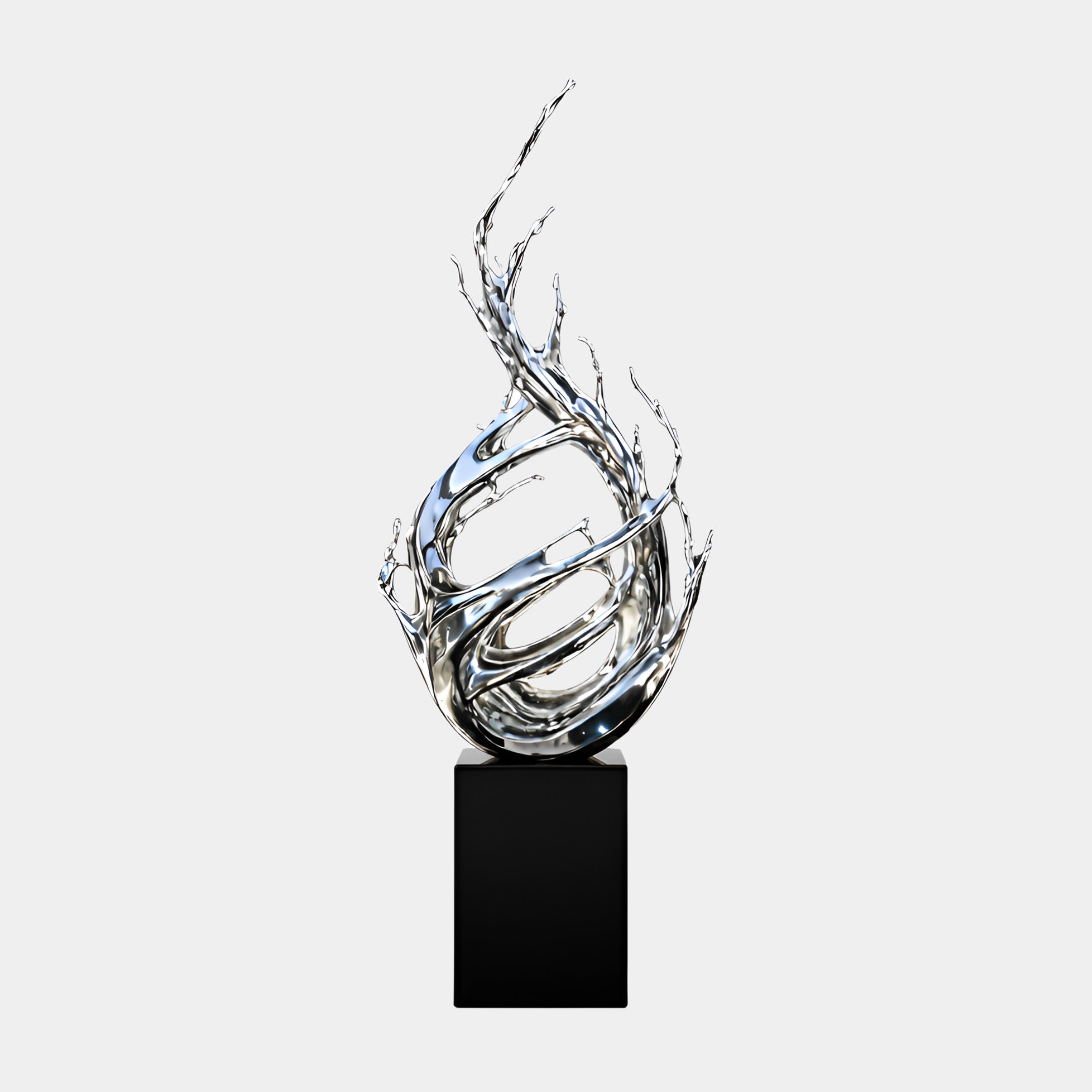 The Surge Silver Abstract Steel Sculpture - 320cm by Giant Sculptures features a shiny, swirling design that resembles liquid or flames, mounted on a black rectangular pedestal against a plain white background.