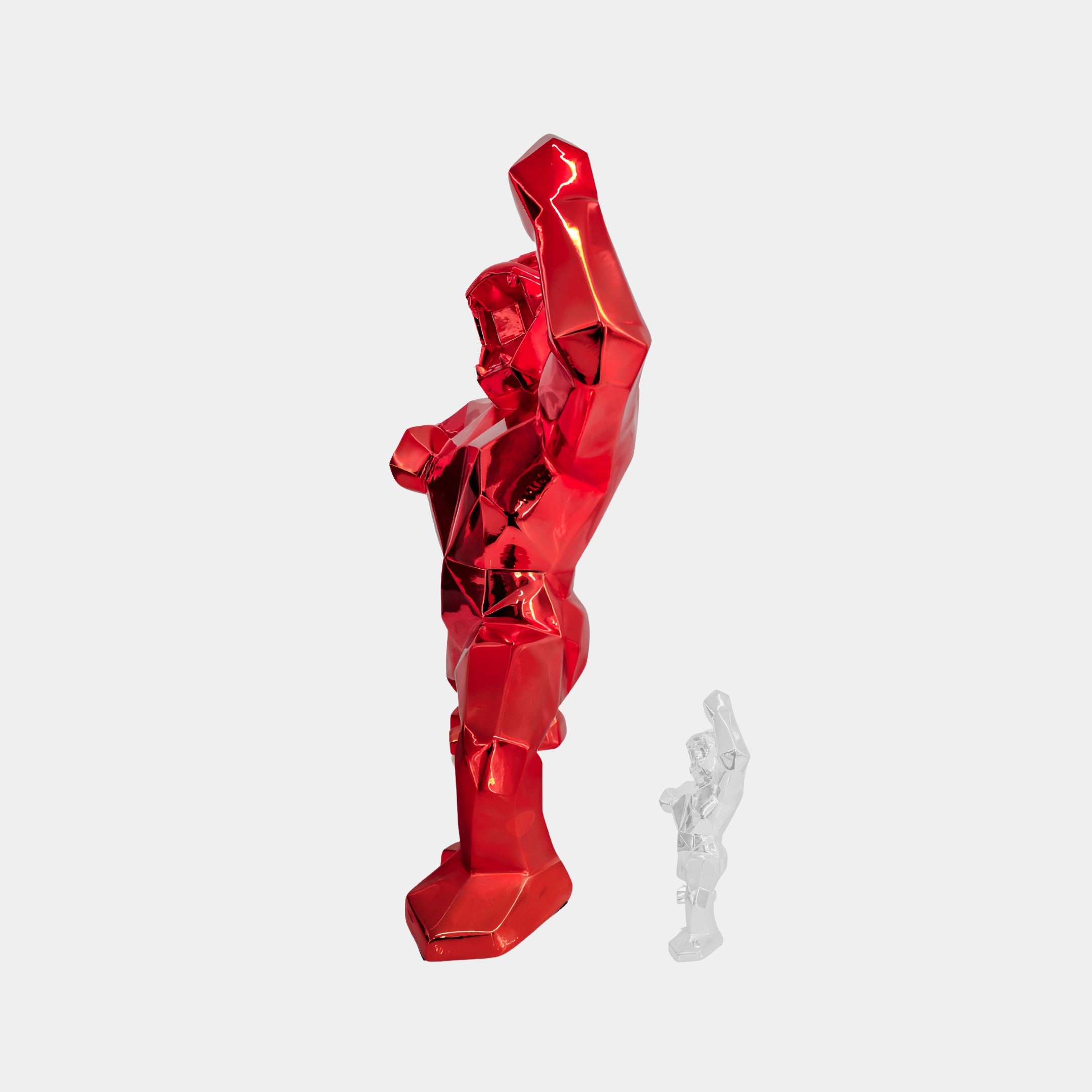 Two faceted gorilla sculptures by Giant Sculptures stand against a plain background, perfect for contemporary decor. The larger Fire Red Gorilla Sculpture - 165cm raises its fists, mimicked by the smaller clear one, both with stunning geometric designs.