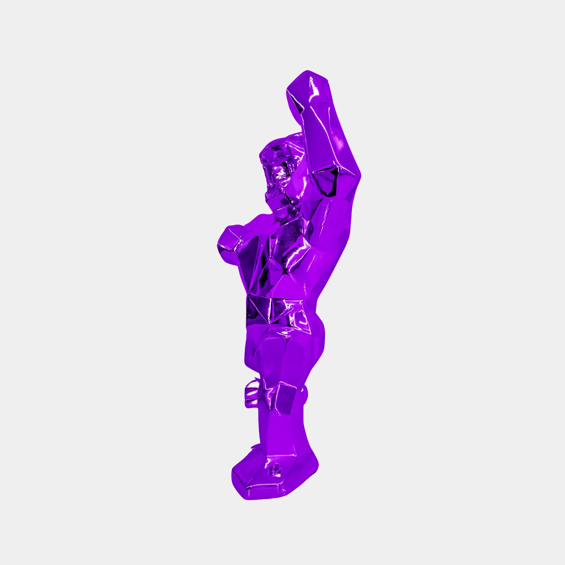 The Phantom Purple Gorilla Sculpture - 50cm by Giant Sculptures features one arm raised against a white background. Its metallic finish enhances the geometric shapes of high-quality resin, making it an ideal choice for modern interior decor.