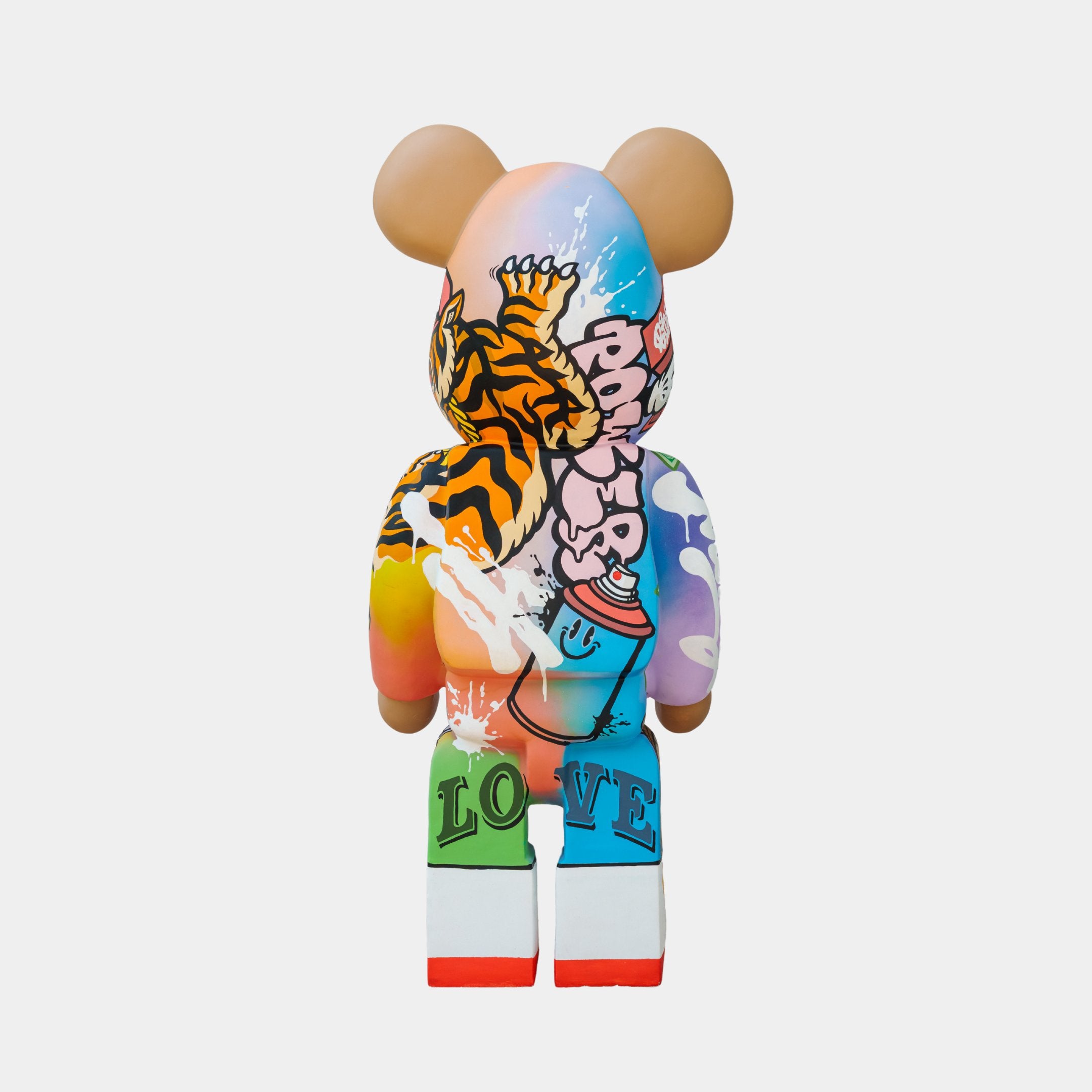 Introducing the Lucky Paws Bear Sculpture - 50cm by Giant Sculptures, a vibrant, limited edition piece featuring a tiger, graffiti elements, and LOVE. This colorful artwork stands gracefully against a plain backdrop, merging art and creativity in one stunning display.