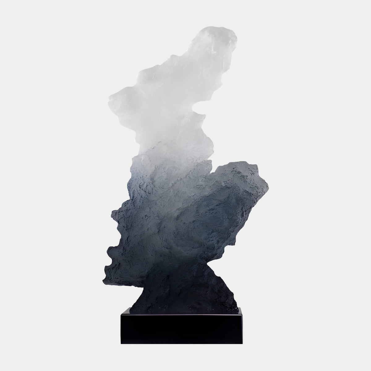White to Charcoal Frosted Scholar's Rock Resin Sculpture, 77cm, rising from a craggy charcoal base to a white frosted peak, on a black marble stand, plain light background.