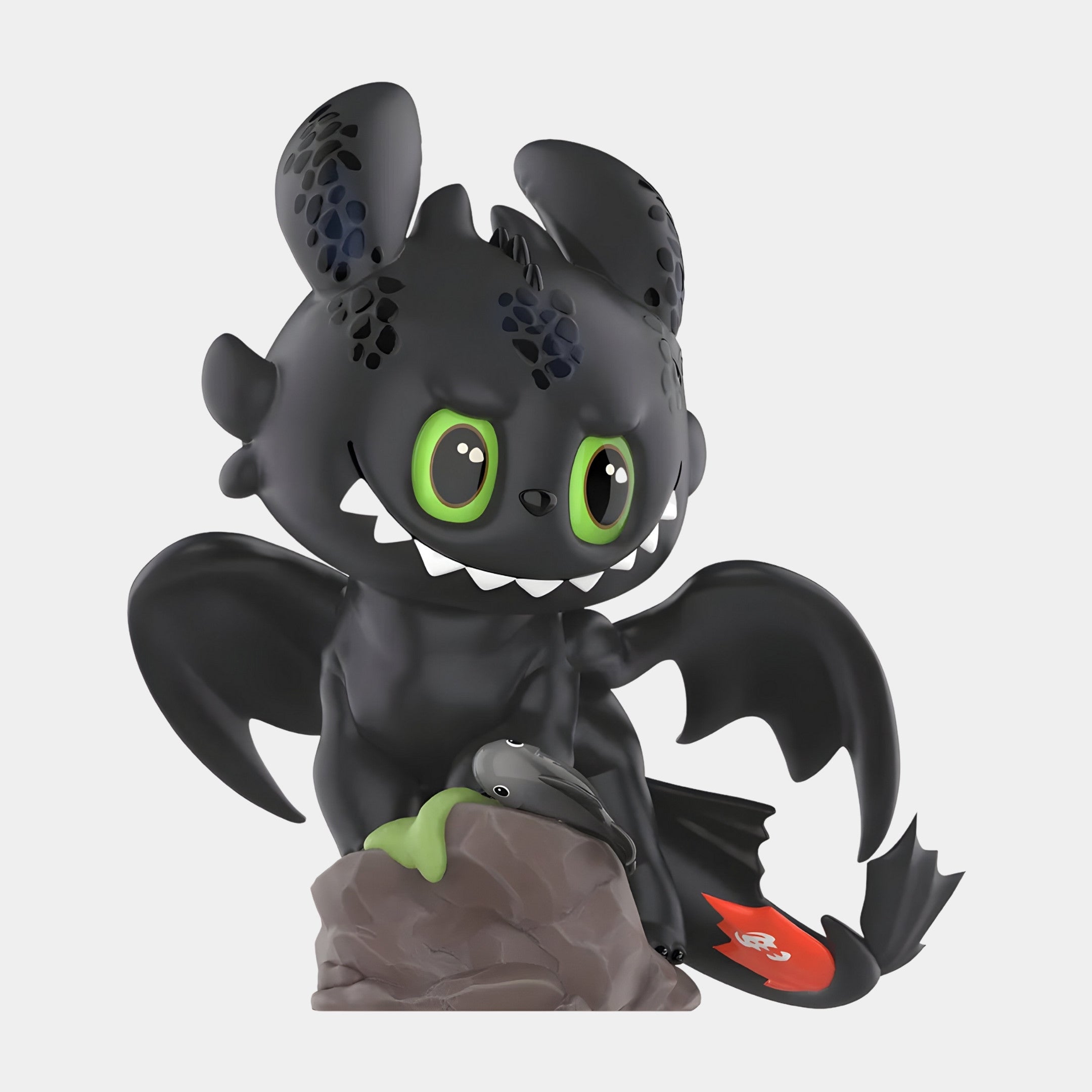 The Dragon Bond Toothless Labubu Sculpture (100cm) by Giant Sculptures features a cartoonish black dragon with large green eyes, big ears, a red tail mark, and spread wings—perfect for any pop culture collectibles enthusiast.
