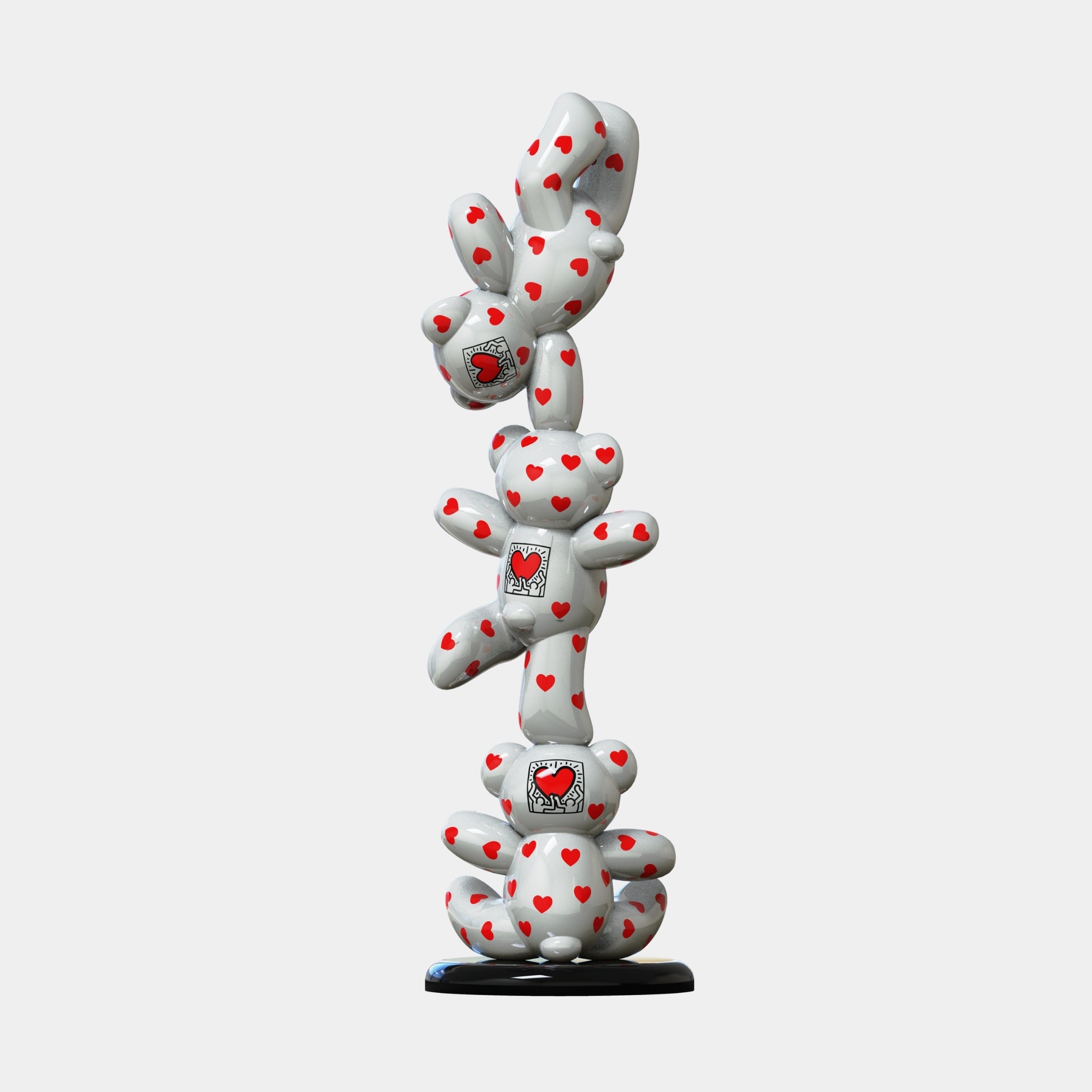 The Gacko Keith Love Triple Bear Sculpture (90cm) by Giant Sculptures features four white teddy bears with red hearts, each holding a heart picture, stacked on a black base—a vibrant pop art piece for modern spaces.