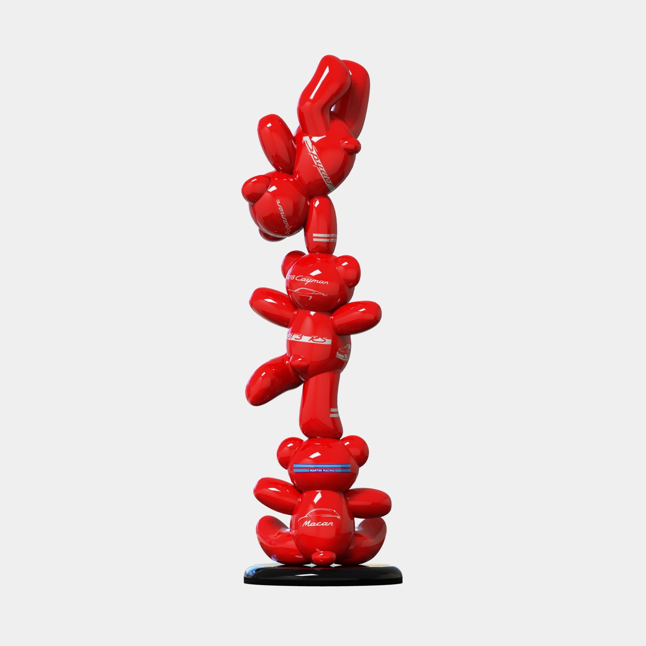 The Gacko Porsche Triple Bear Sculpture by Giant Sculptures features three glossy red bear forms stacked vertically on a round black base, creating a striking modern statement piece at 90cm tall.