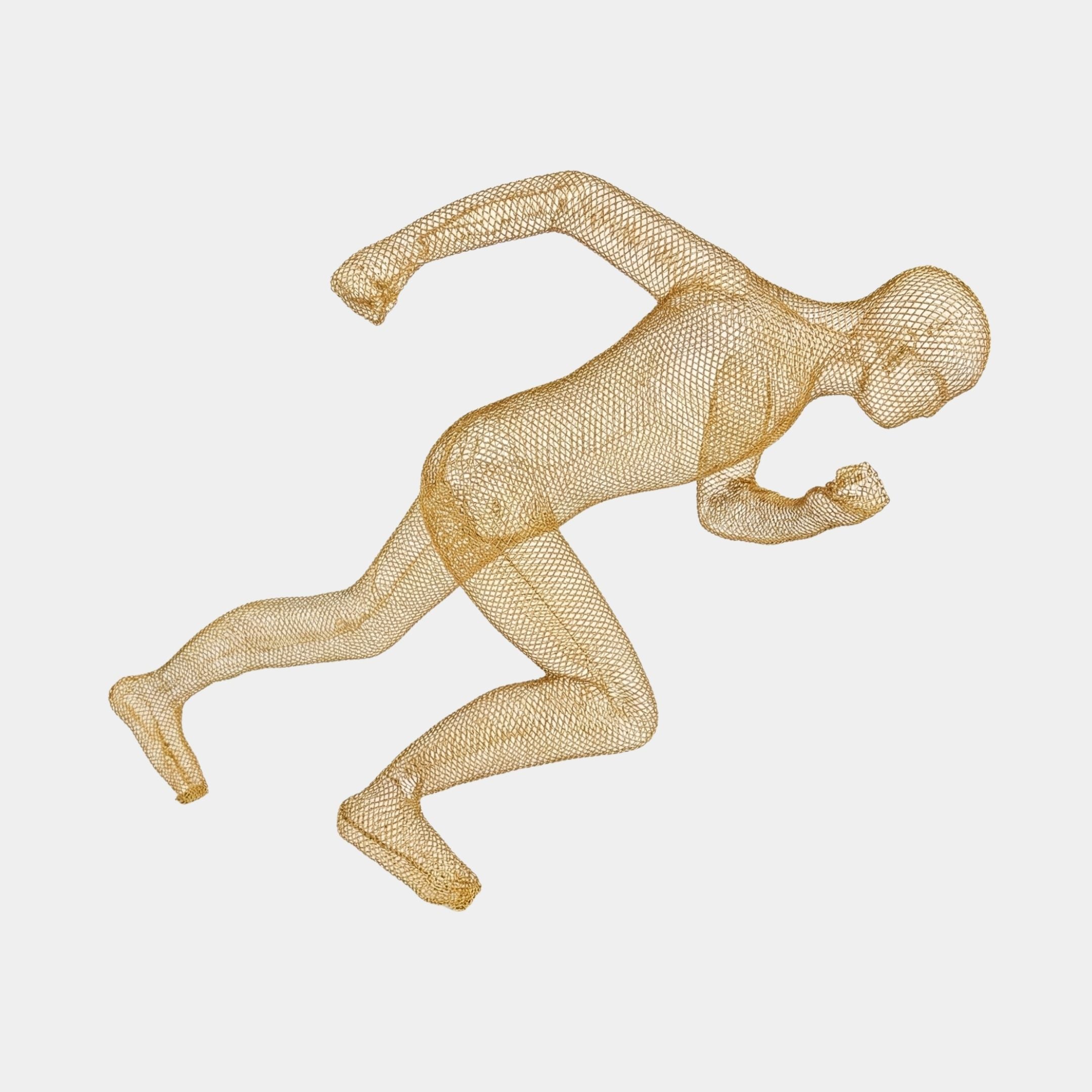 Giant Sculptures Gold Wire-Mesh Running Man metal sculpture shown mid-sprint with leaning forward pose, viewed from the side against a plain light background.