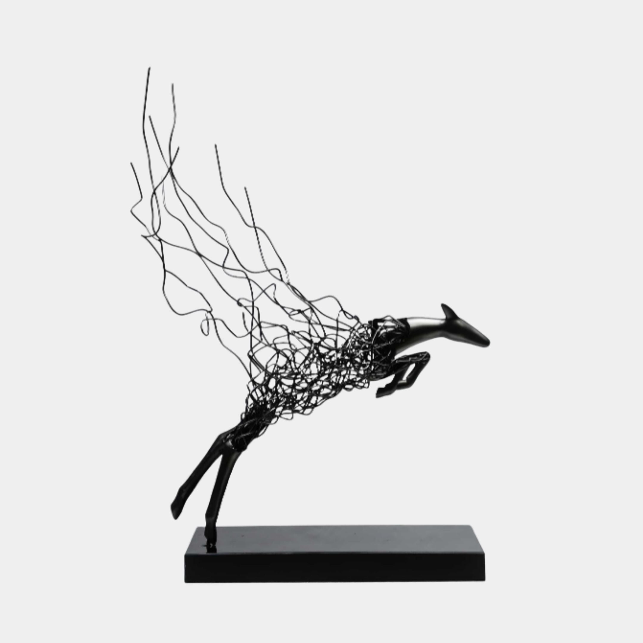 Black Wire-Frame Leaping Deer Metal Sculpture by Giant Sculptures, shown in side view with solid head and legs trailing into wild wire strands on a rectangular base.
