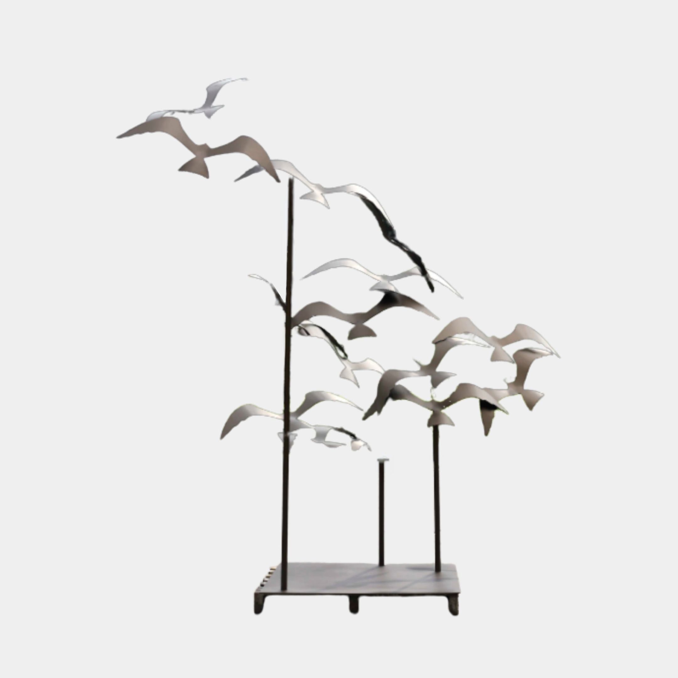 Giant Sculptures Matte Grey Flock of Birds Metal Garden Sculpture 270cm, seagulls in flight on rods rising from three poles on a marble base.