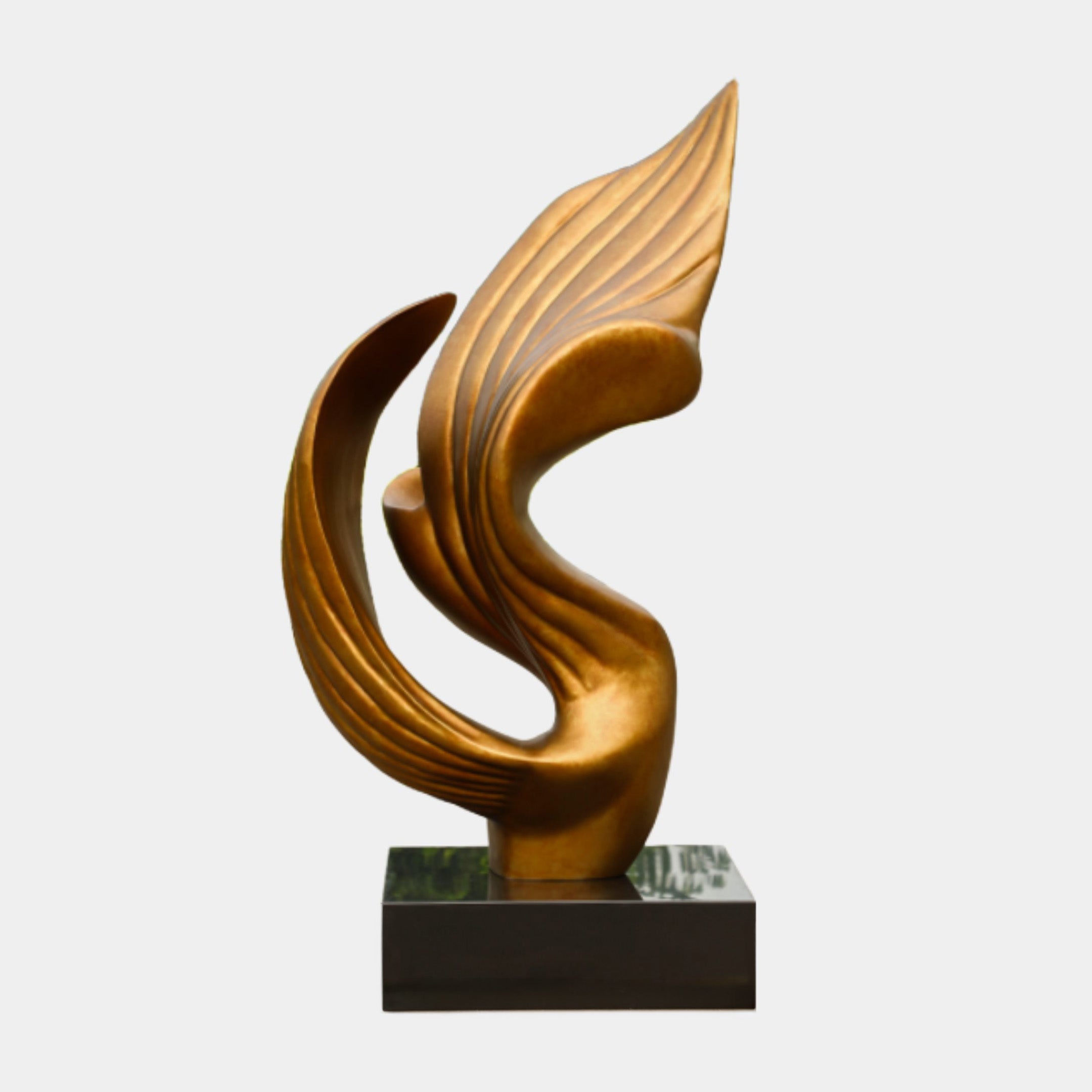 Burnished Gold Swirl Abstract Metal Sculpture 165cm by Giant Sculptures, a flame-like grooved form rising from a black cube base on a plain background.