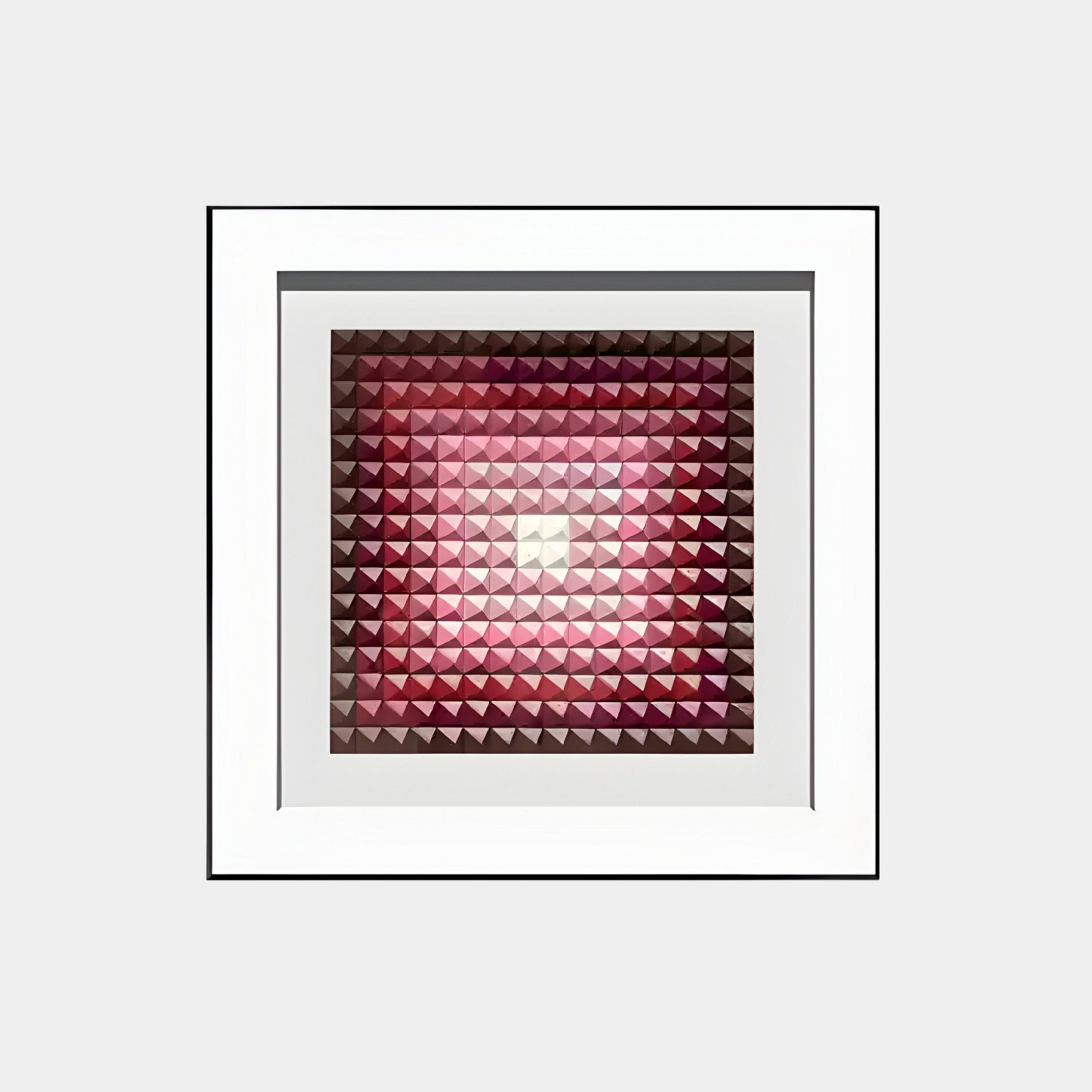 The Viretta Red Gradient Pyramid Textured 3D Wooden Wall Art by Giant Sculptures features a framed grid of small, three-dimensional pyramid tiles in red and pink gradients, creating striking depth and a glowing center.
