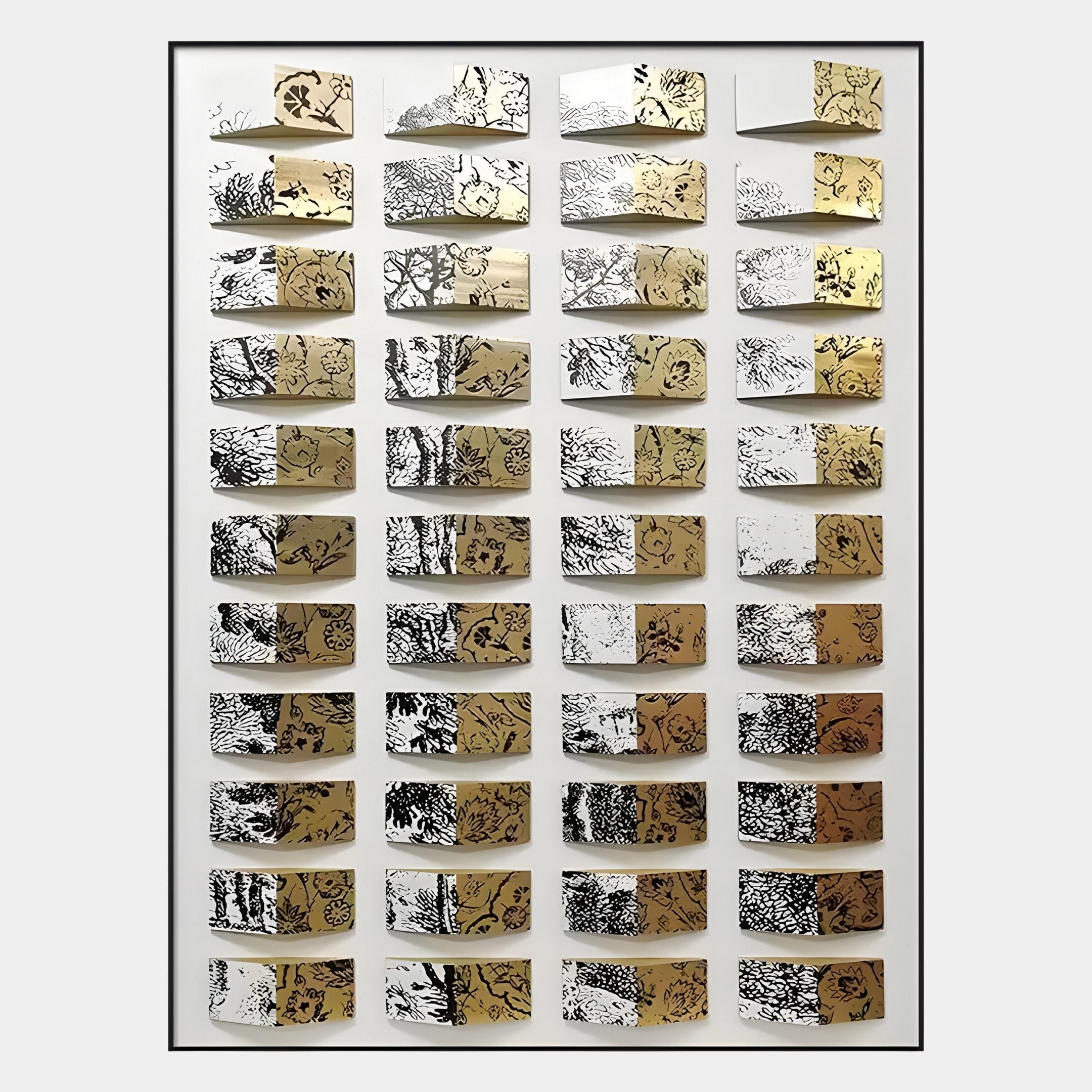 The Muraluxe Gold & Black Curved Mosaic 3D Wooden Wall Art by Giant Sculptures features rows of gold and white panels with intricate black botanical and abstract designs; some curved panels bend outward for a dynamic, mosaic look.