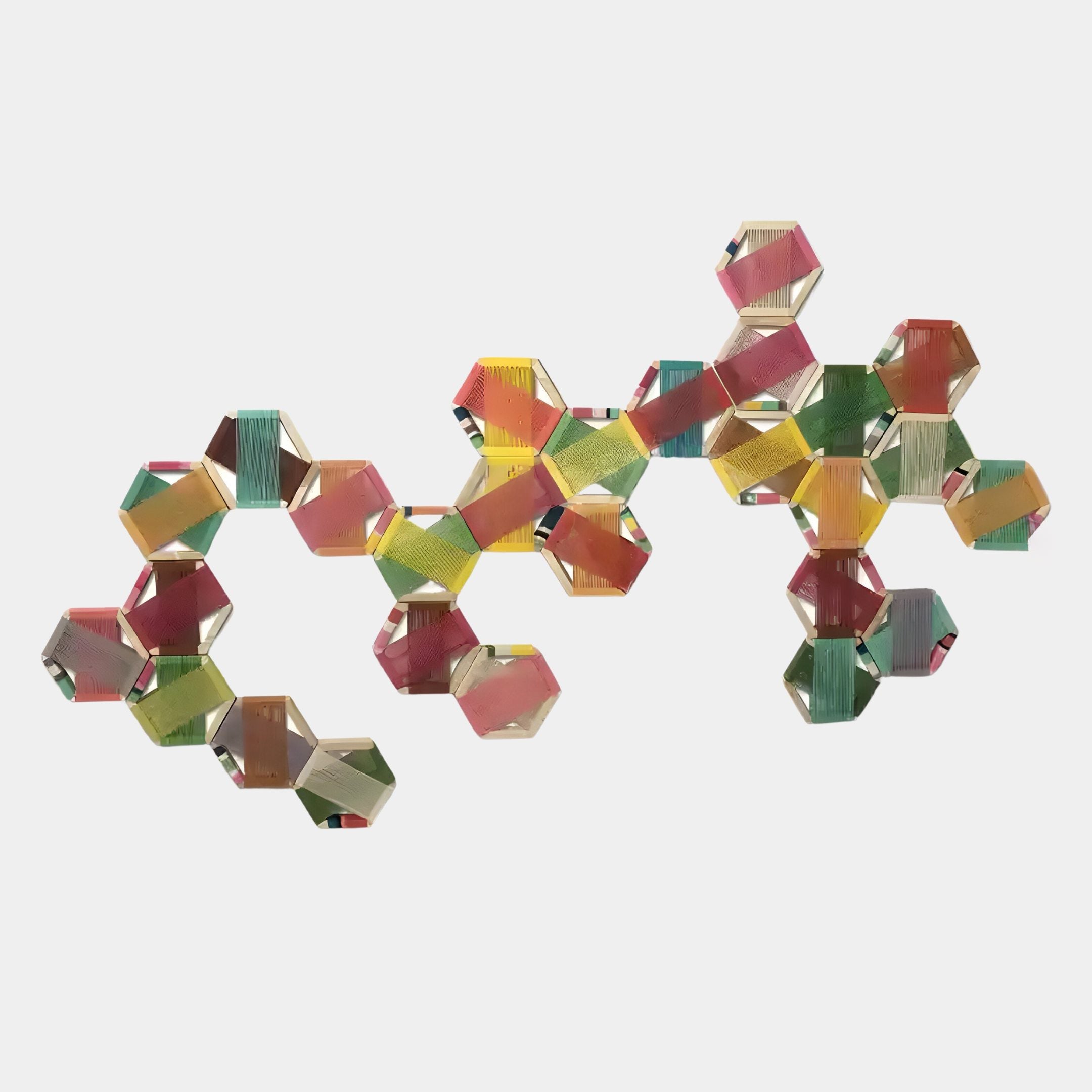 The Spectra IV Multicoloured Interwoven Hexagonal Frame 3D Wall Art by Giant Sculptures features vibrant red, yellow, green, and blue geometric hexagons connected on a white background.